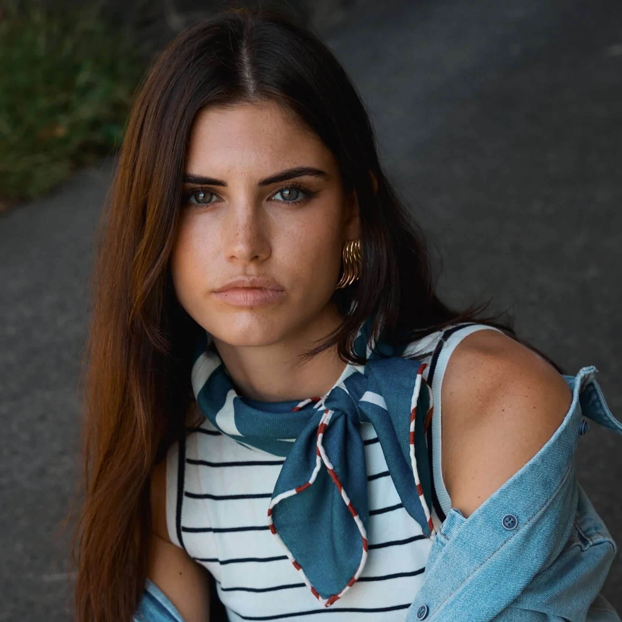 Alt Tag: Good & Co Heritage Neckerchief Wool & Silk Scarf - Denim worn as a neckerchief, double-sided herringbone blend for effortless style