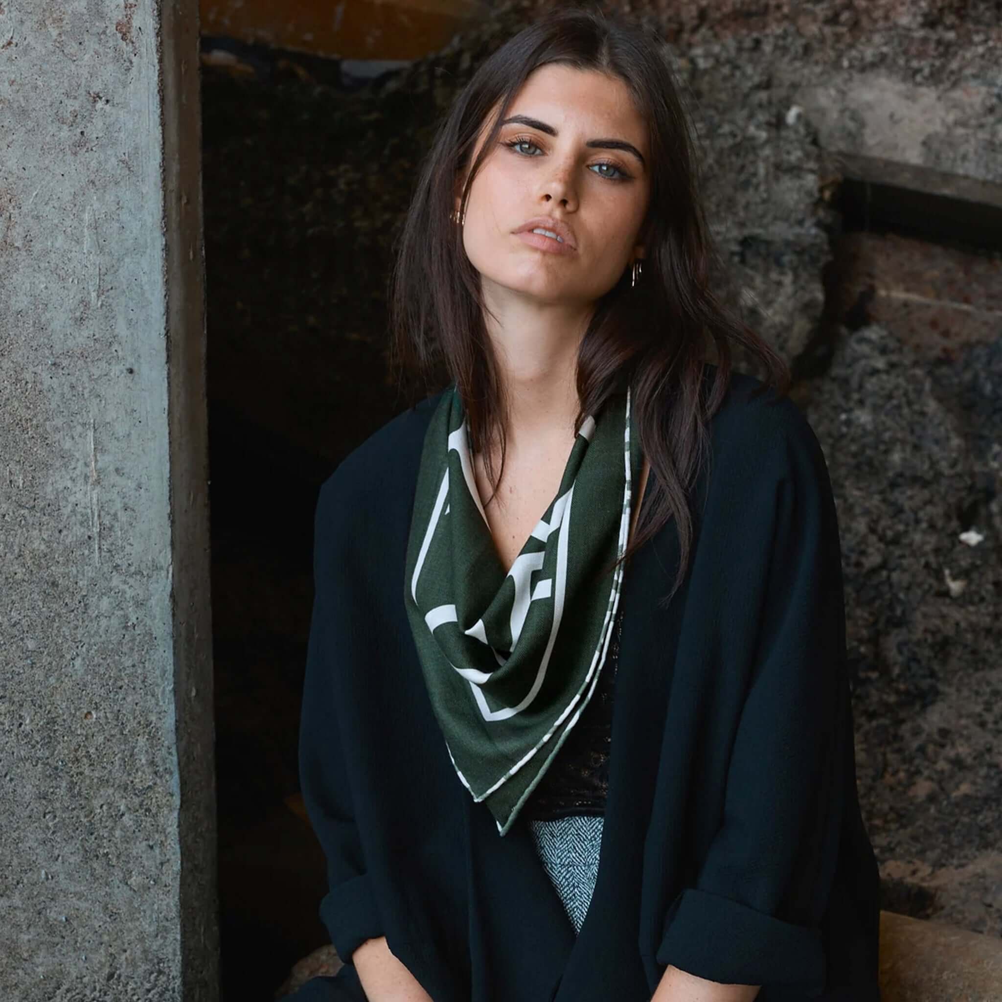Alt Tag: Good & Co Heritage Neckerchief Wool & Silk Scarf - Forest worn as a neckerchief on model, double-sided herringbone blend