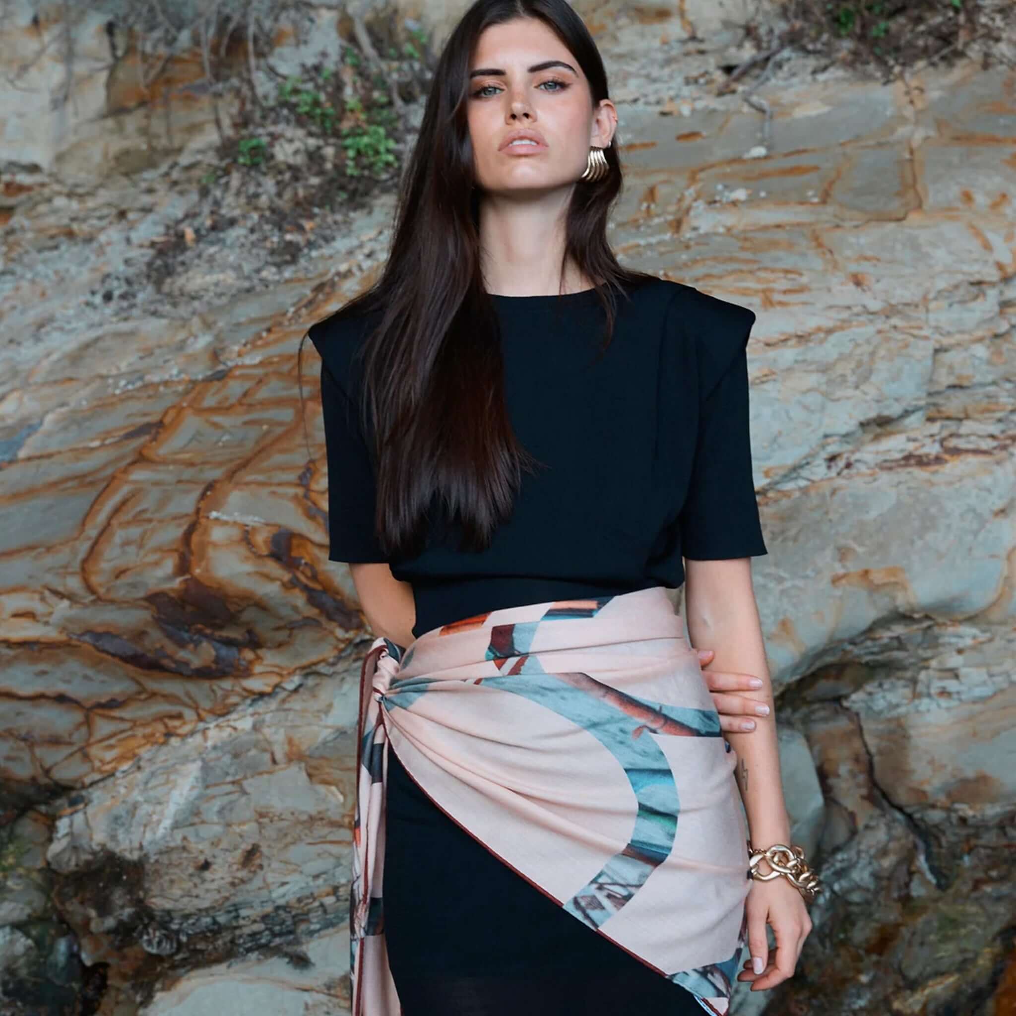 Good & Co Heritage Triangle Wool & Silk Scarf - Blush worn as a wrap on model, oversized blush triangle scarf with heritage logo print