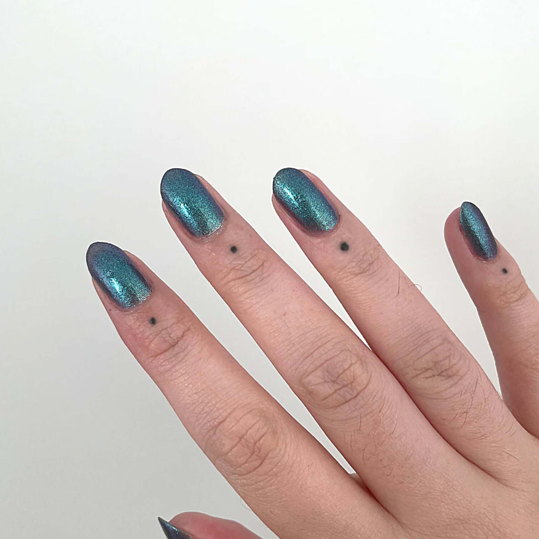 Alt Tag: Hanami Plant Based Nail Polish - Phenomena shimmering teal manicure on hand, vegan 21-free plant-based breathable nail colour