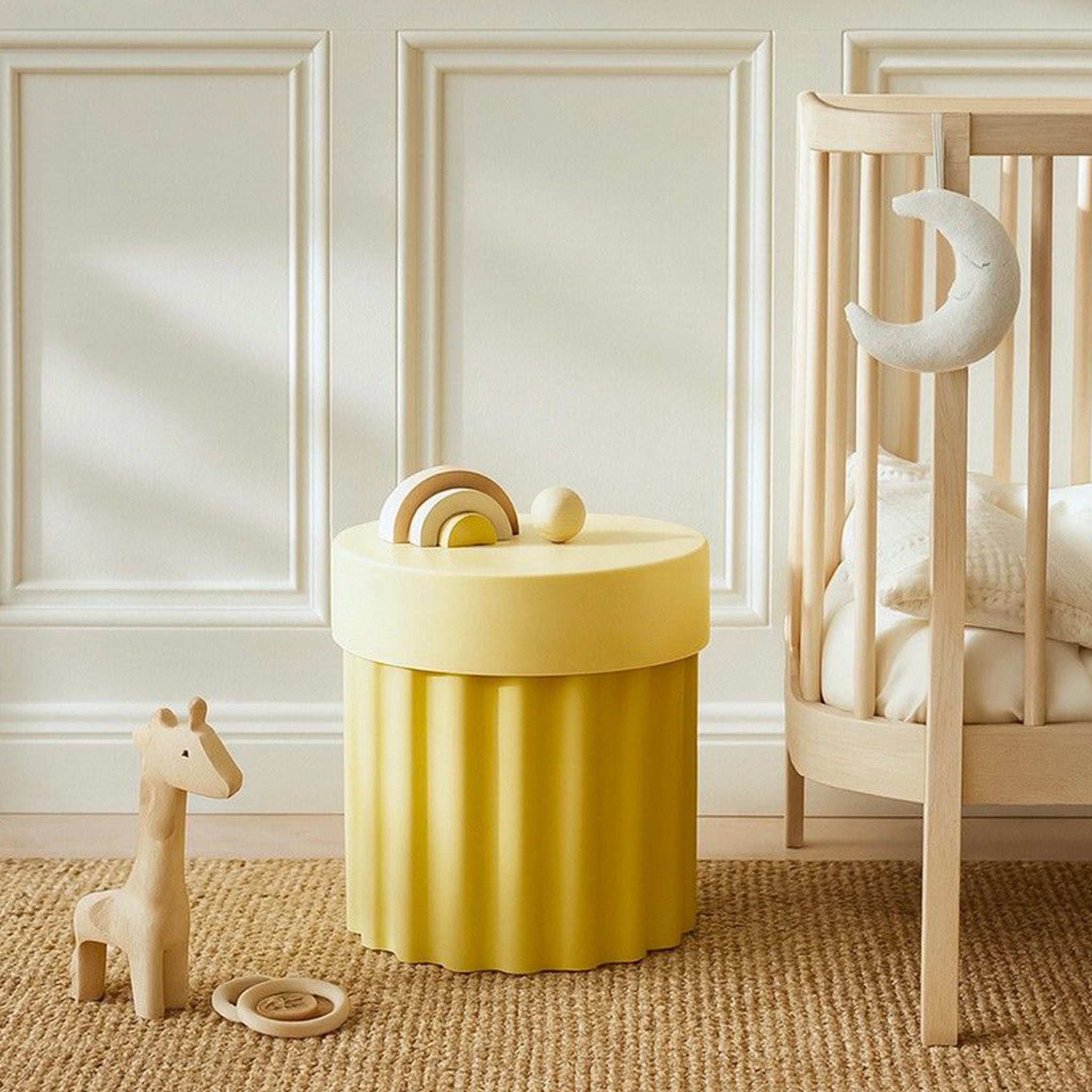 Harry Stool / Side Table in Green in a baby's bedroom setting.