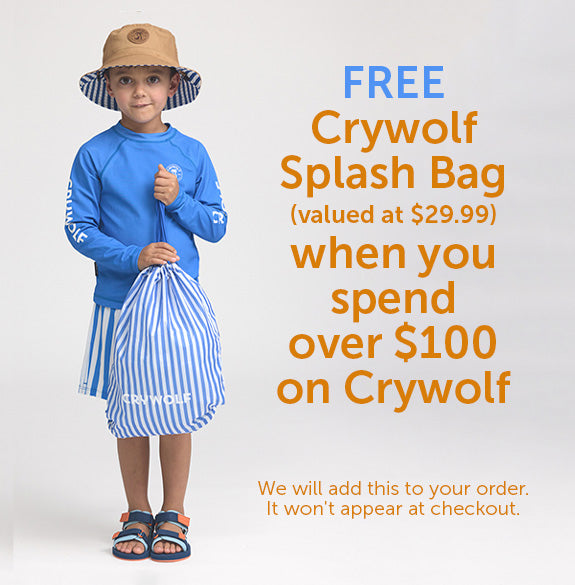 Child wearing a blue Rash Guard and striped shorts, holding a free Crywolf Splash Bag, on a white background.