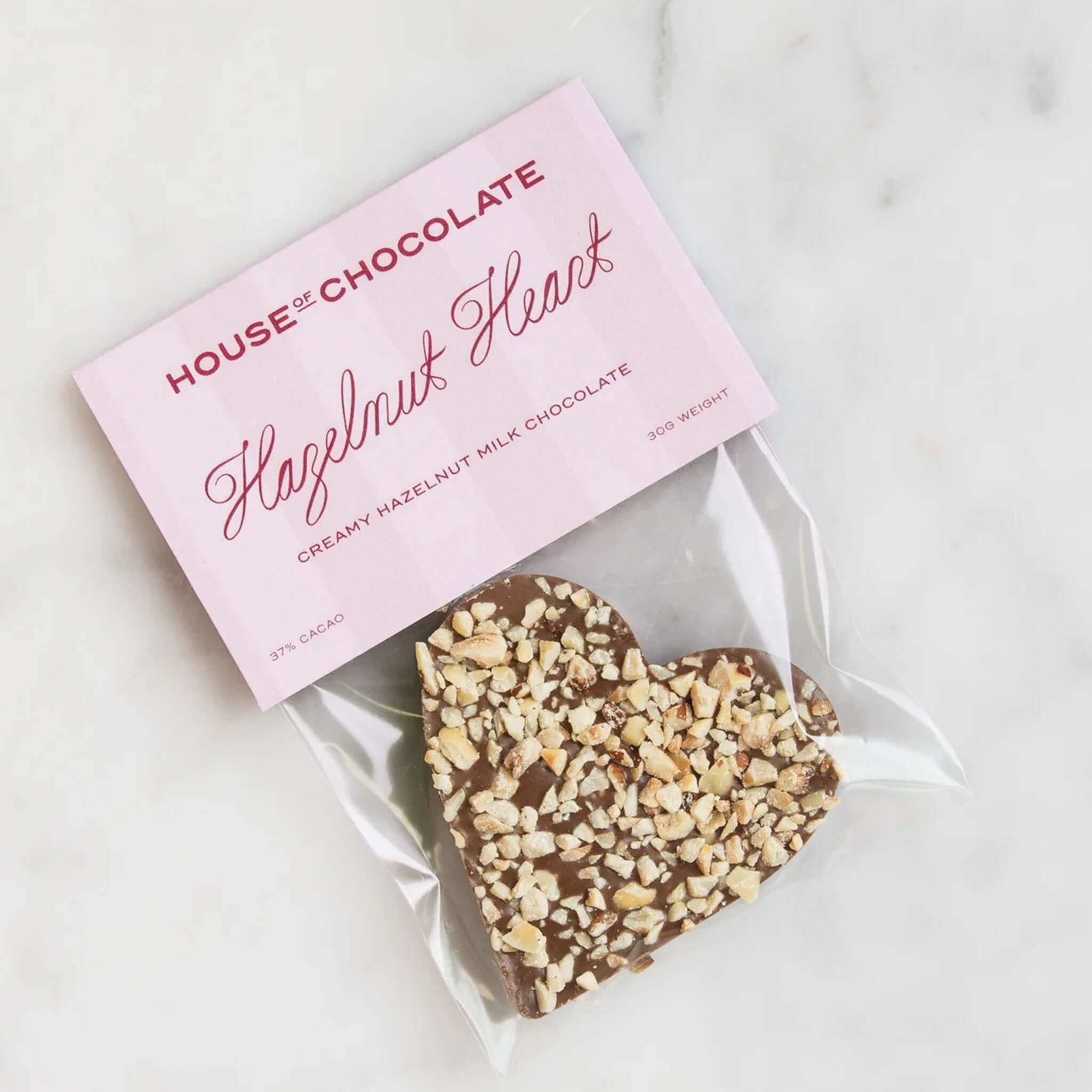 Alt Tag: House of Chocolate Mini Hazelnut Heart Milk Chocolate gift box with hazelnut-topped milk chocolate heart, made in New Zealand