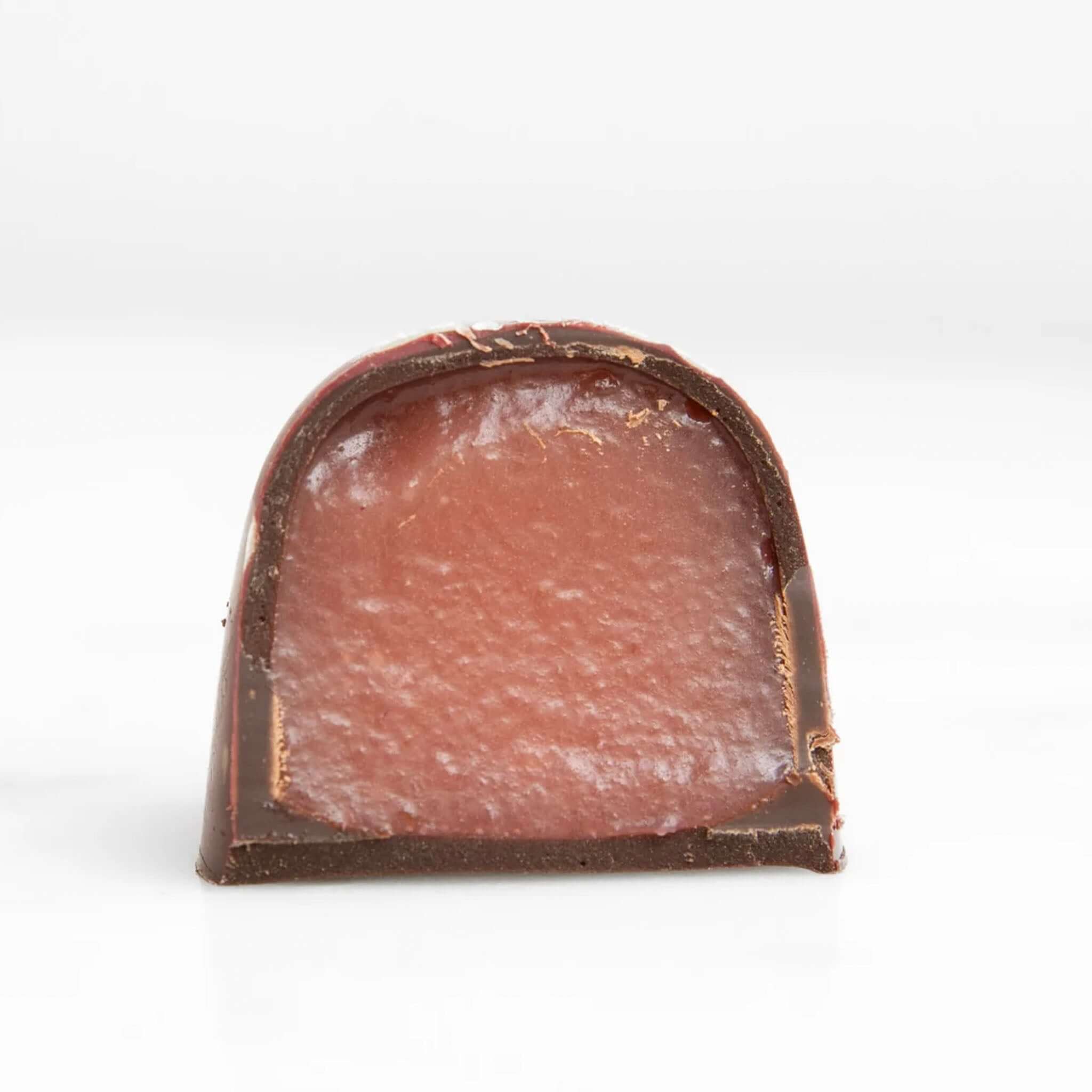 Alt Tag: House of Chocolate Be My Valentine Raspberry Creme Chocolate Bonbons cutaway showing raspberry creme center in 55% dark chocolate