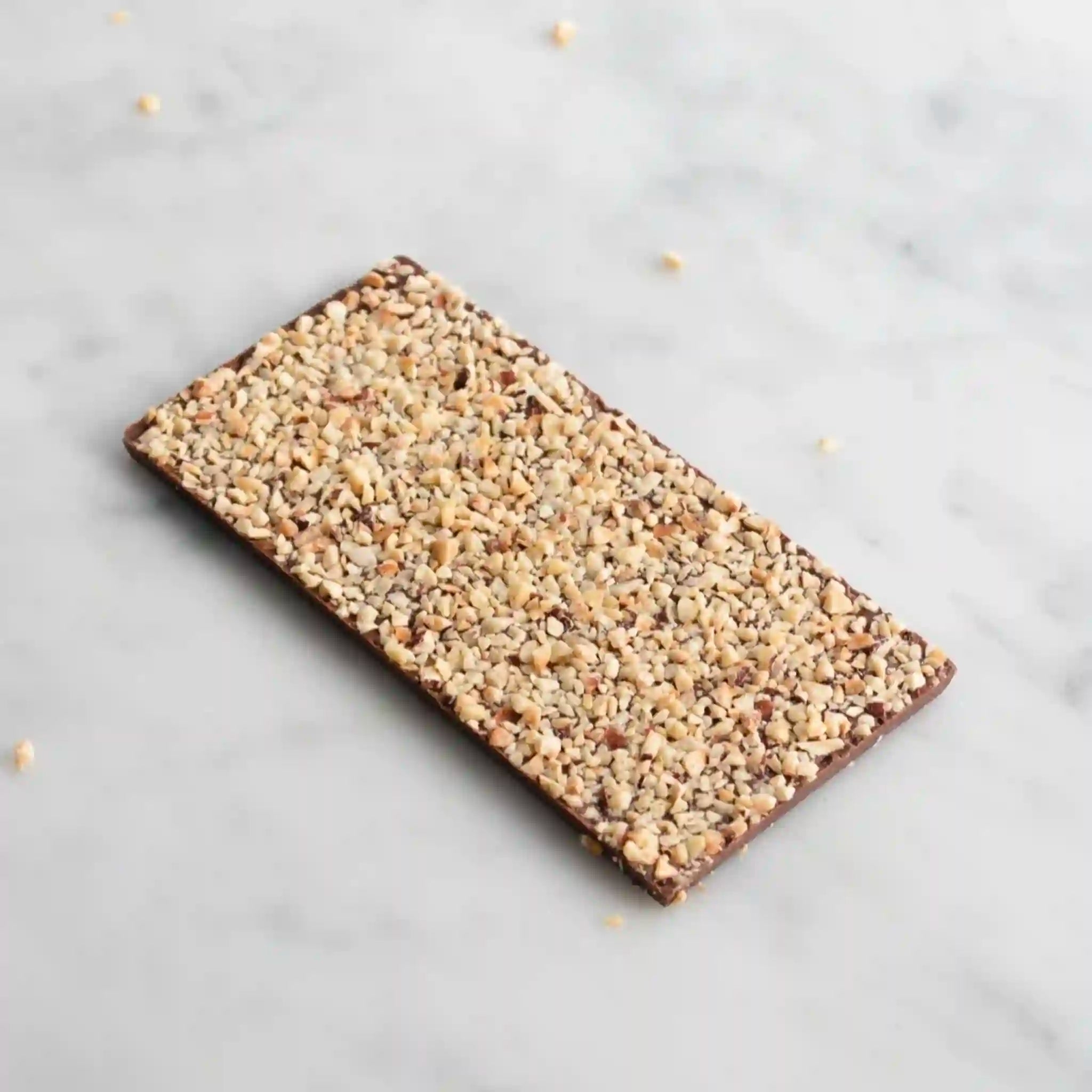 Chocolate with nut son a light gray background