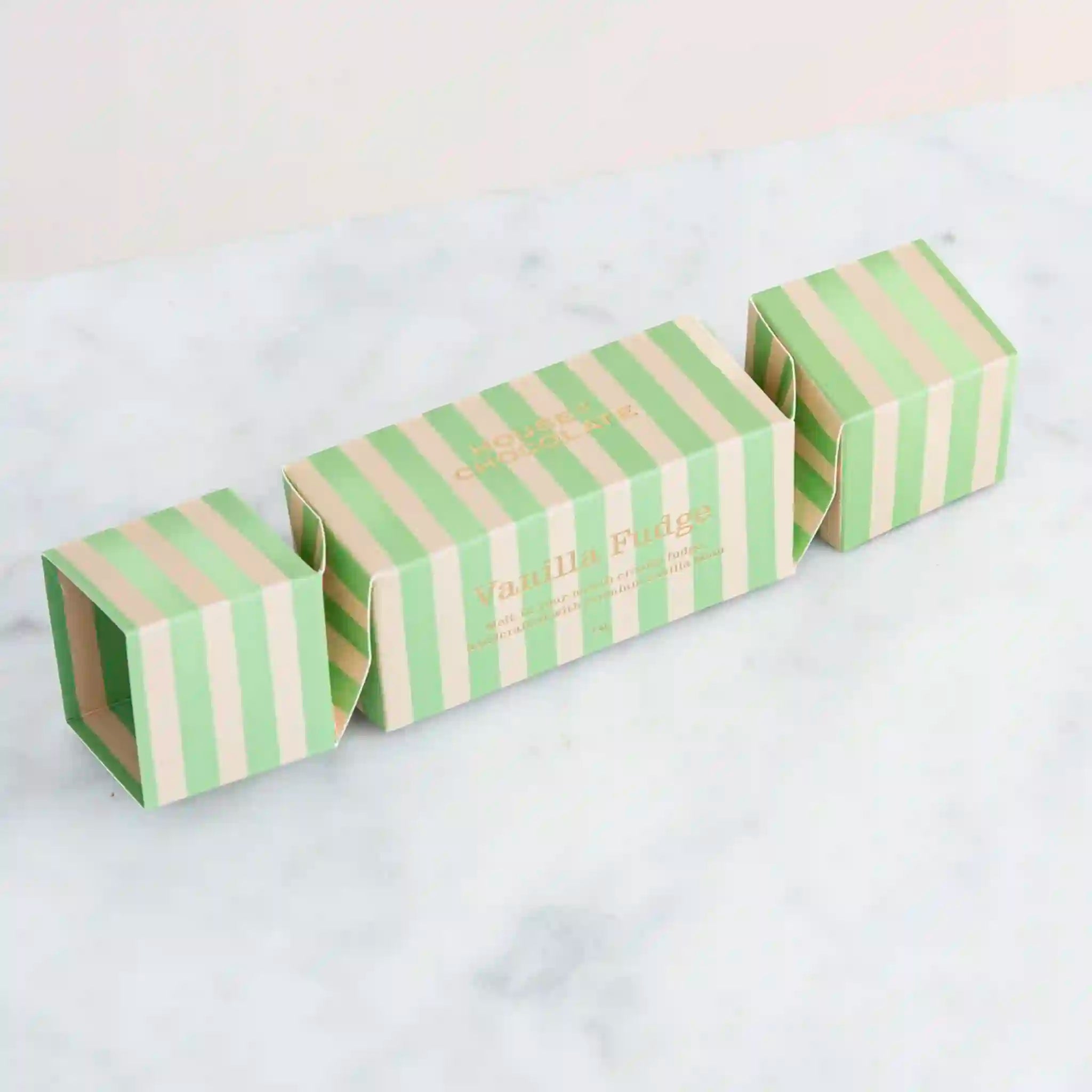 Two green and beige striped boxes on a white background