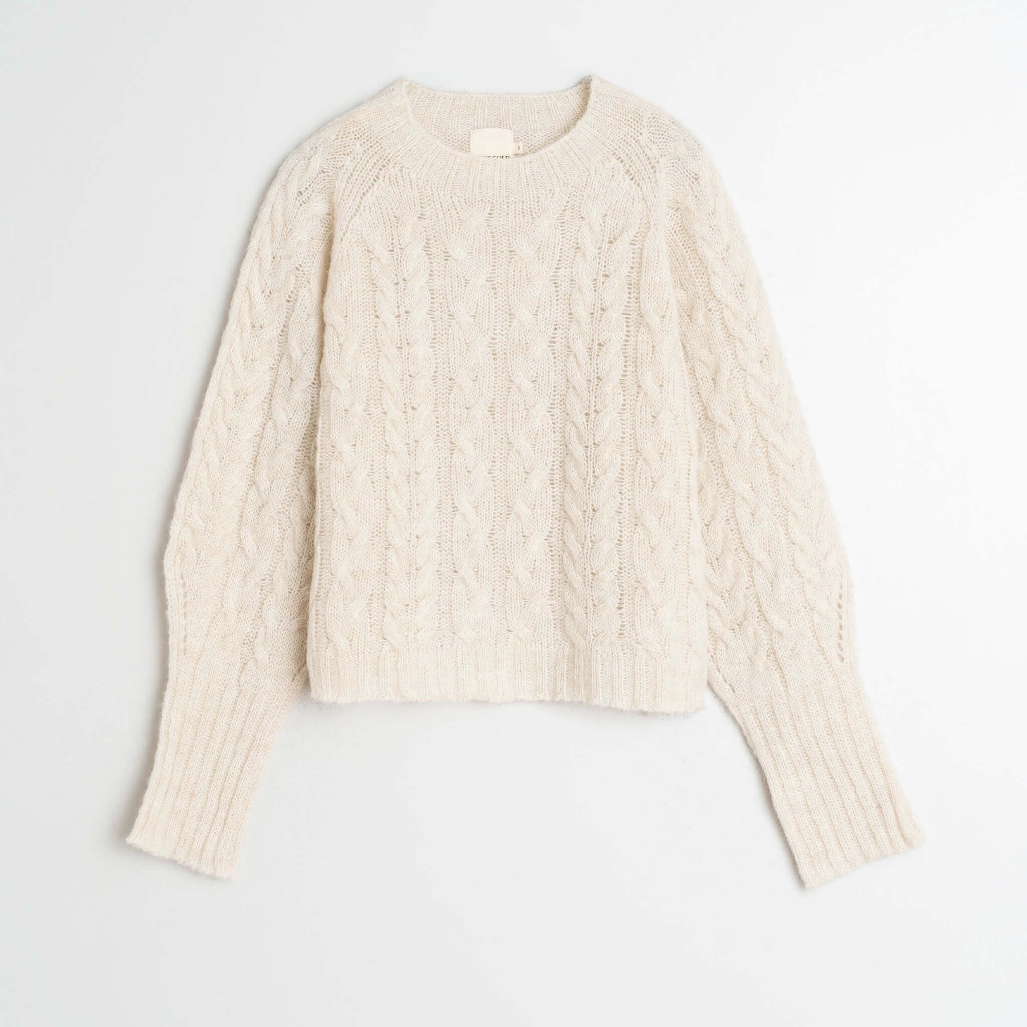 Alt Tag: Indi & Cold Cable Knit Aplaca Blend Jersey - Crudo off-white braided cable knit alpaca blend sweater, crew neck raglan sleeves