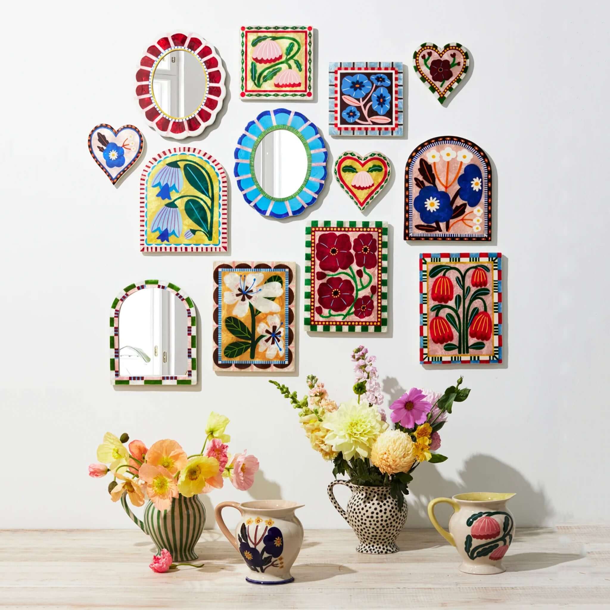 Colorful Capiz shell wall art and floral arrangements featuring the Jones & Co Capiz Shell Bloom Nouveau Series Wall Art - Red Rectangle.