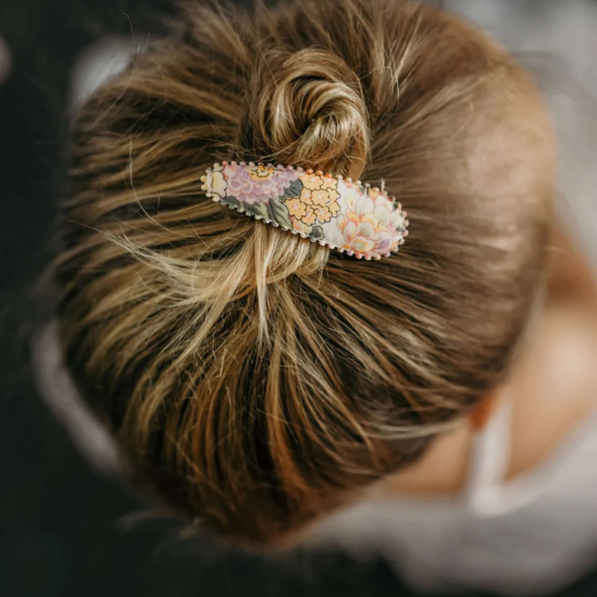 Alt Tag: Josie Joan's Hair Clip Set - Audrey fabric-covered scalloped snap clip with Liberty London floral print in hair bun