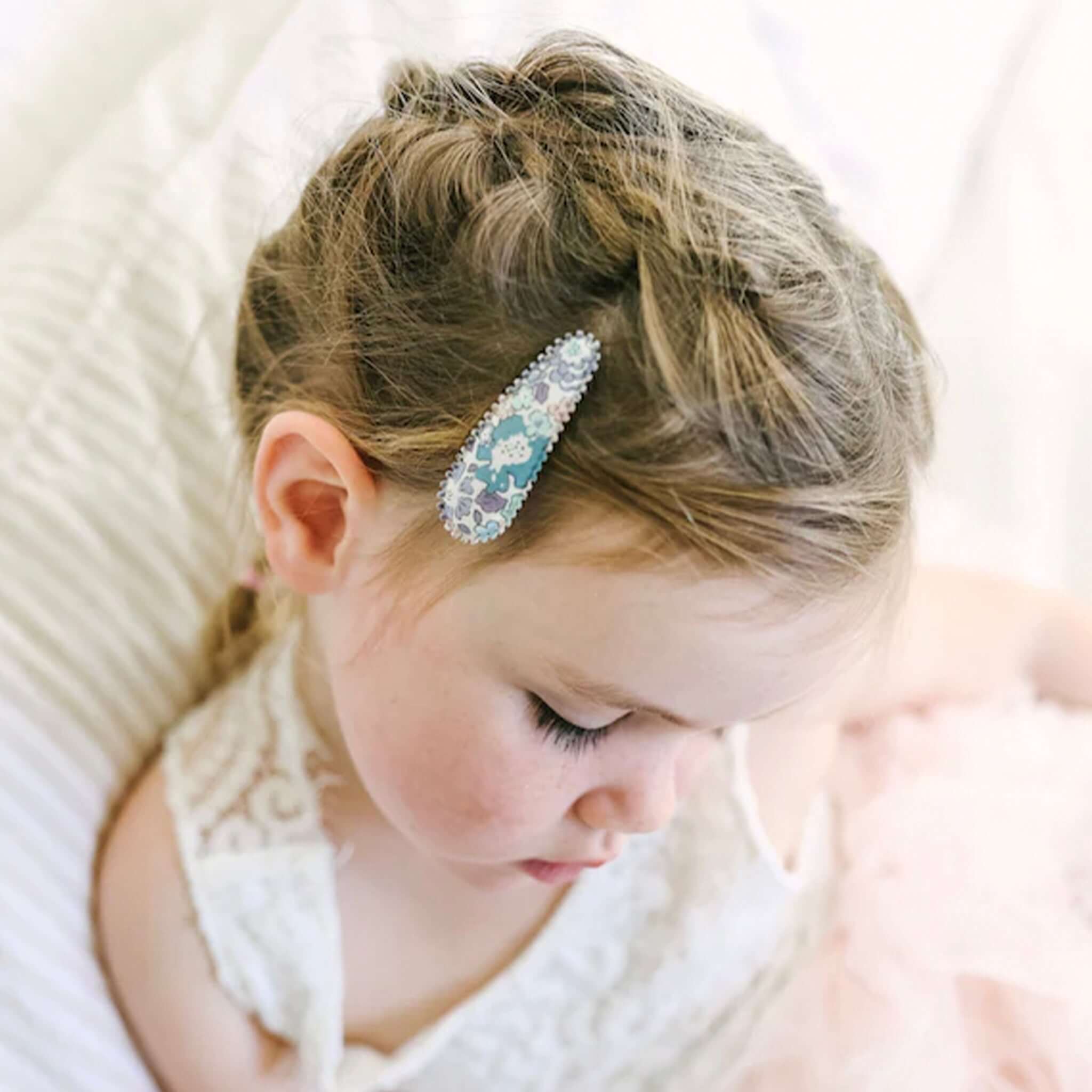 Josie Joan's Hair Clip Set - Suzanne on child wearing fabric-covered Liberty London snap clip with scalloped edge