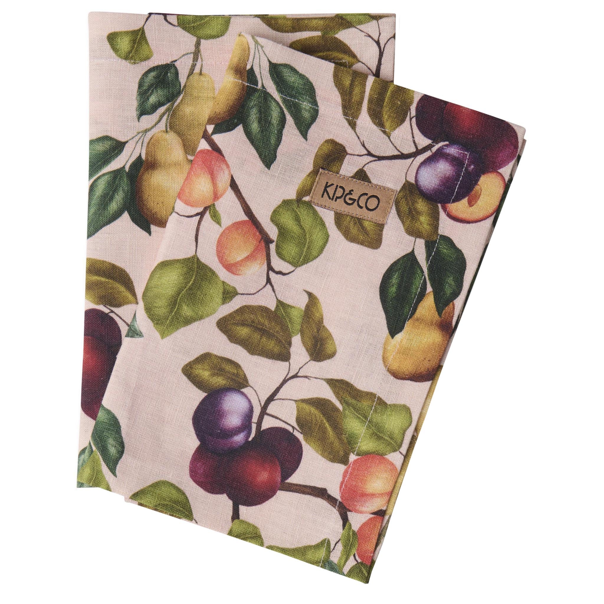 Two patterned towels with fruit design and 'Kip & Co' label on a white background