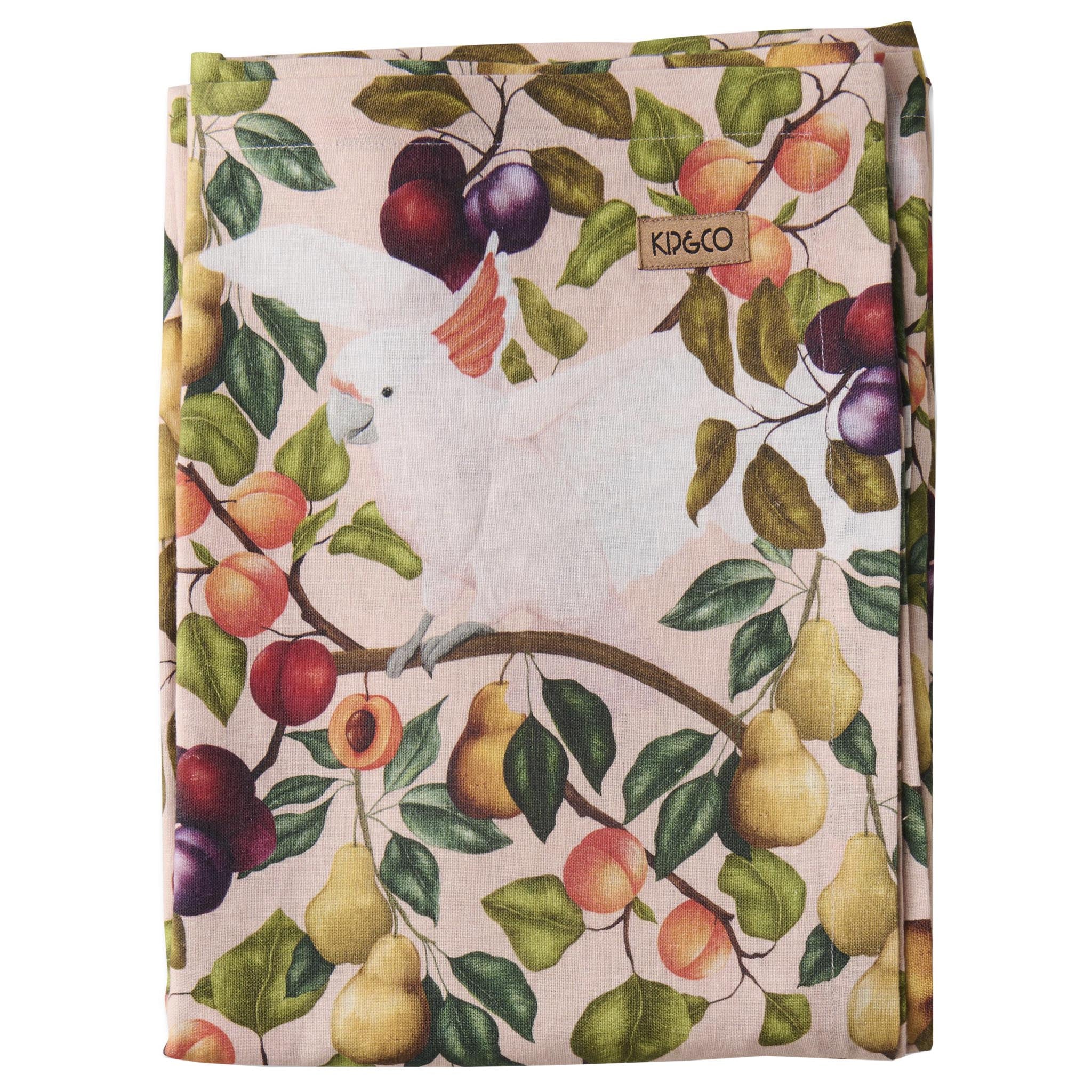 Tablecloth with a bird and fruit pattern, featuring the brand 'Kip & Co'.