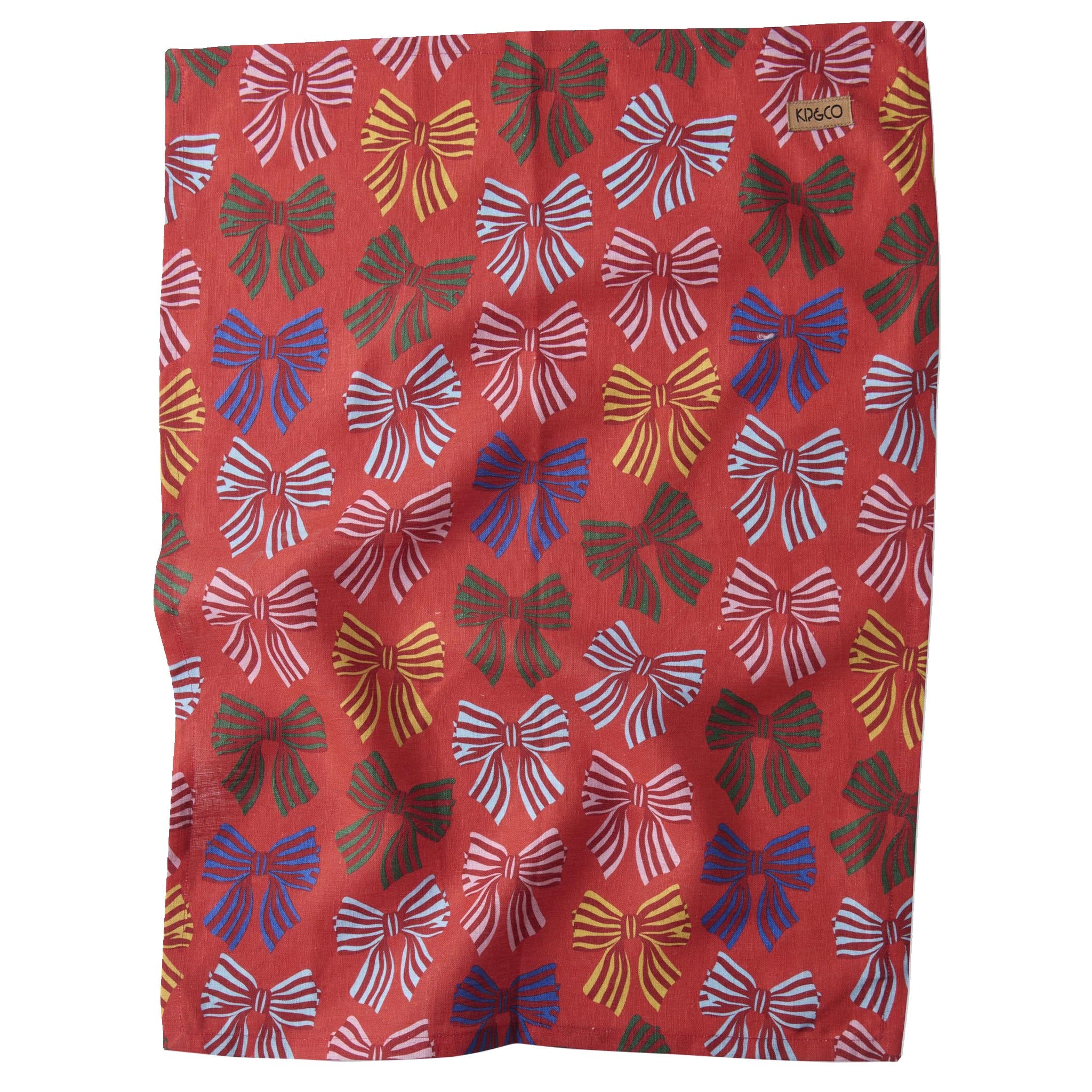 Red tea towel with colorful bow pattern.
