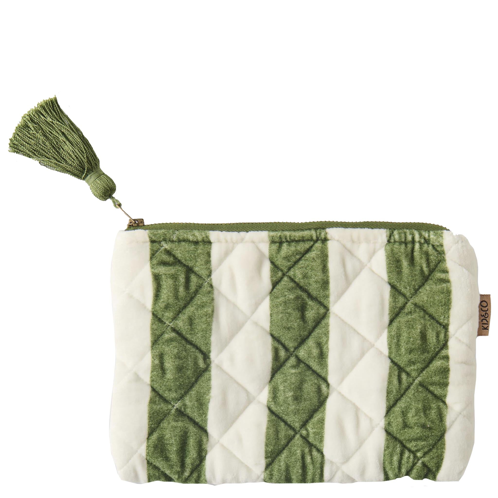 Green and white quilted cosmetic bag with a tassel on a white background