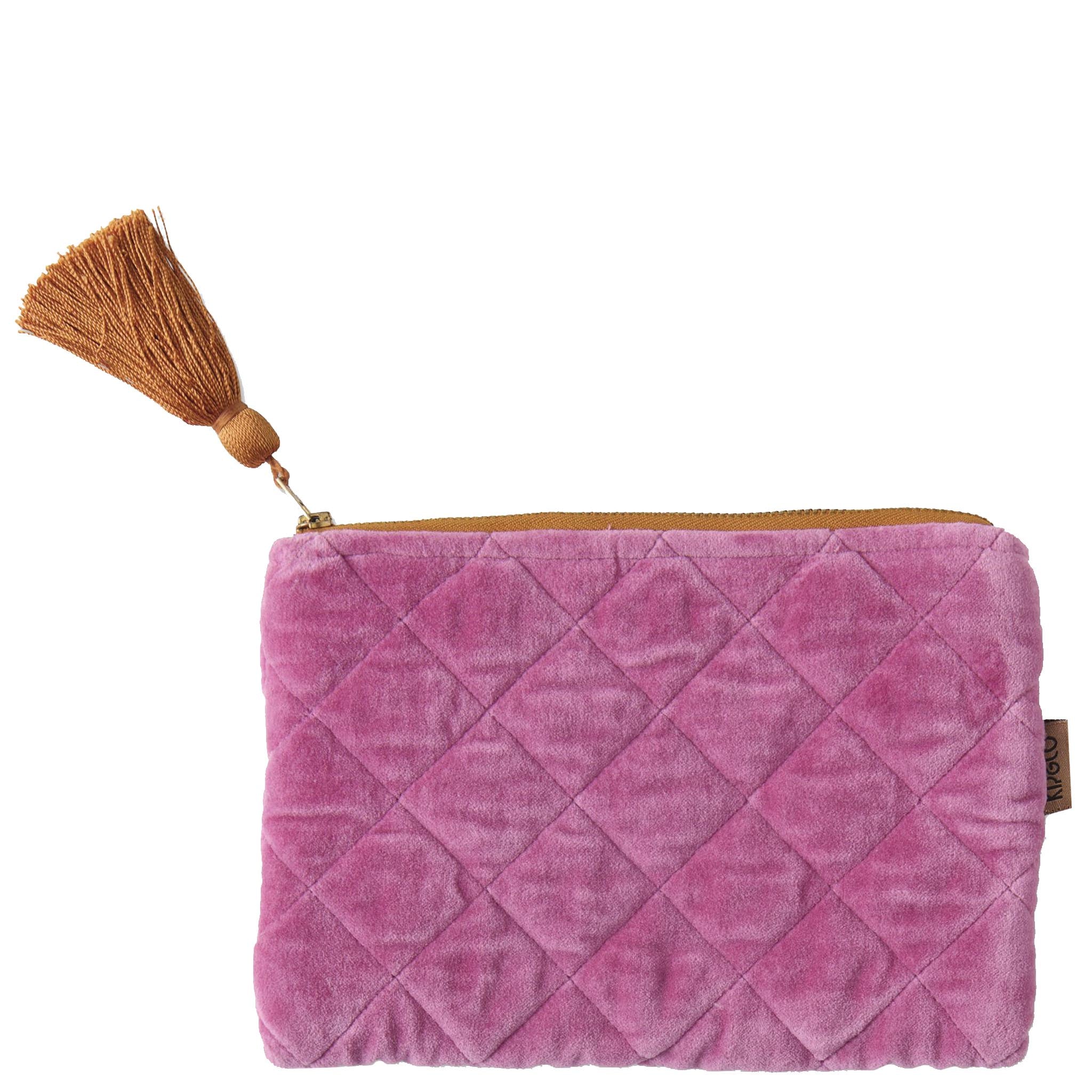 Pink quilted cosmetic bag with a tassel on a white background