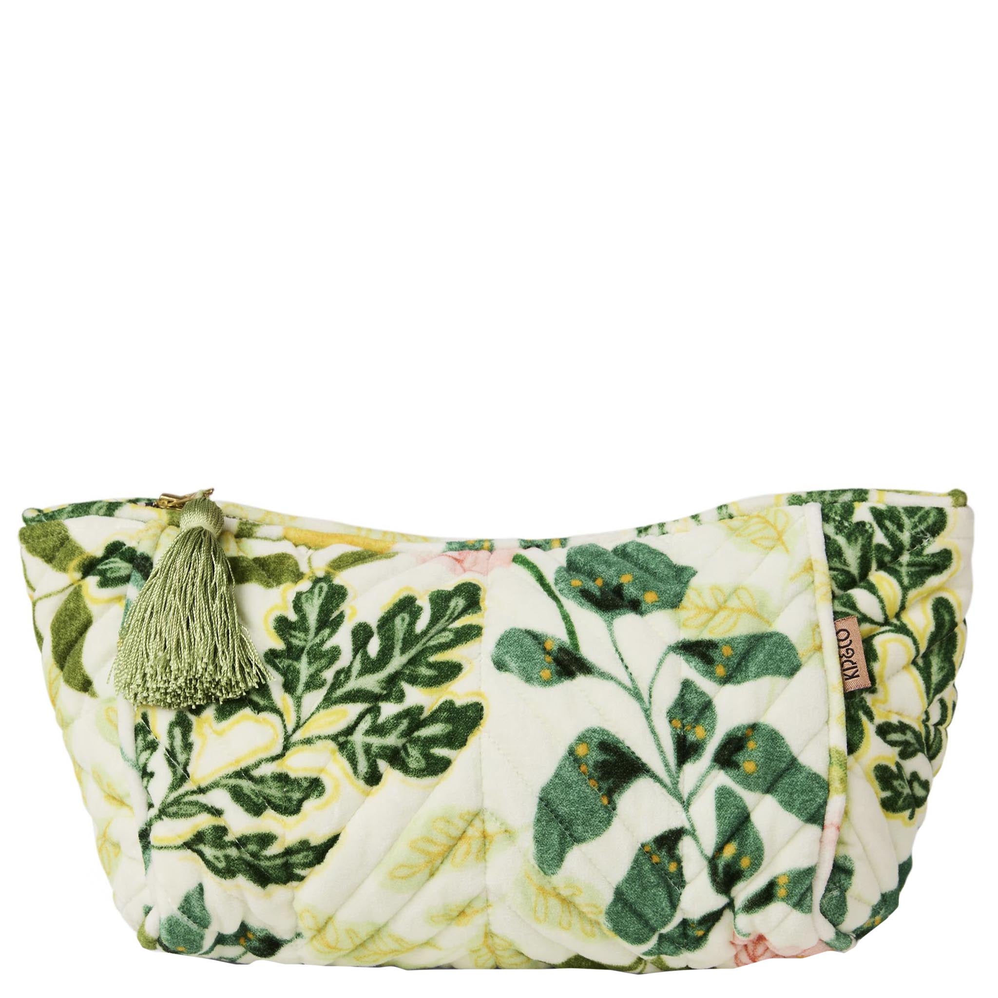 Floral patterned toiletry bag with tassel on a white background