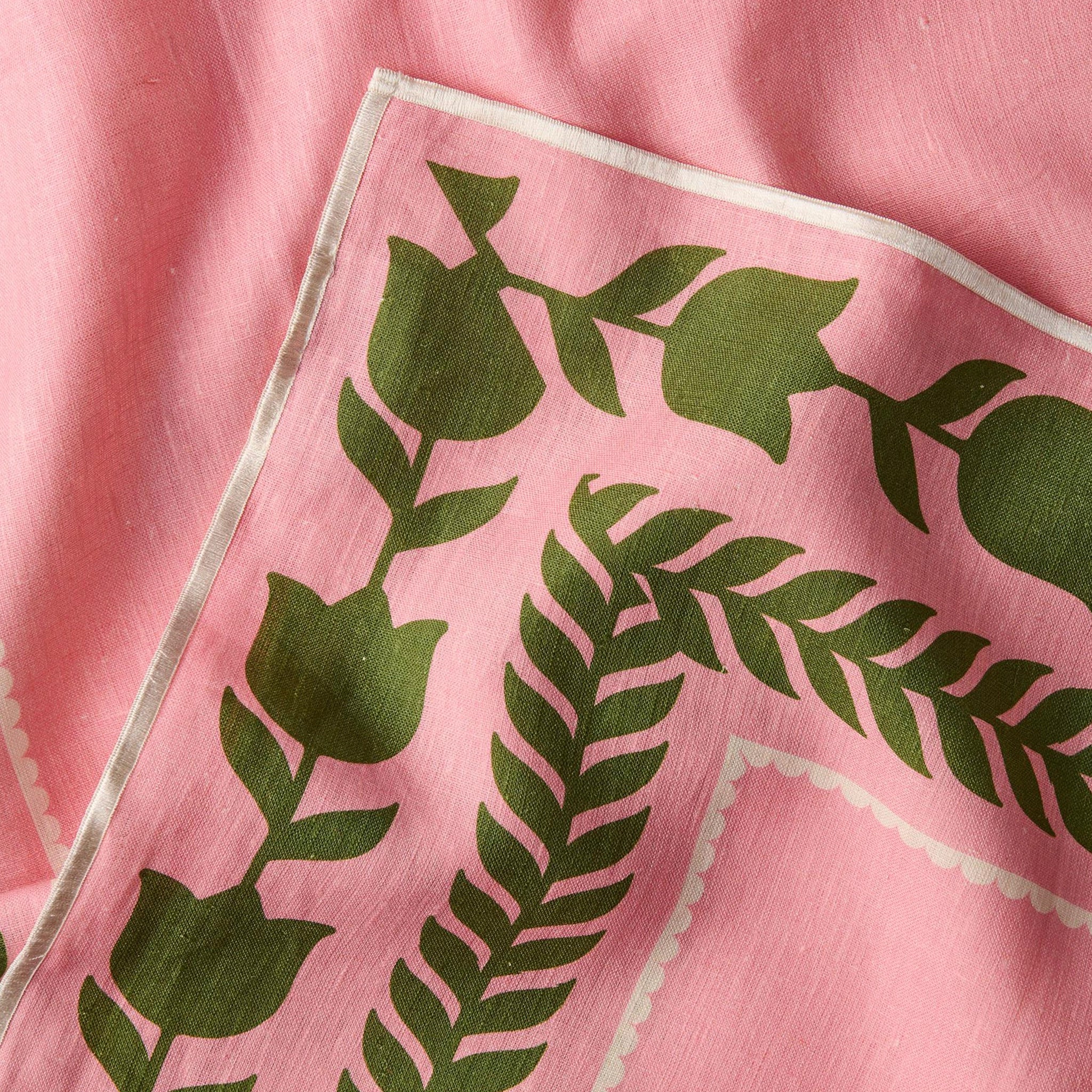 Pink fabric with green leaf pattern