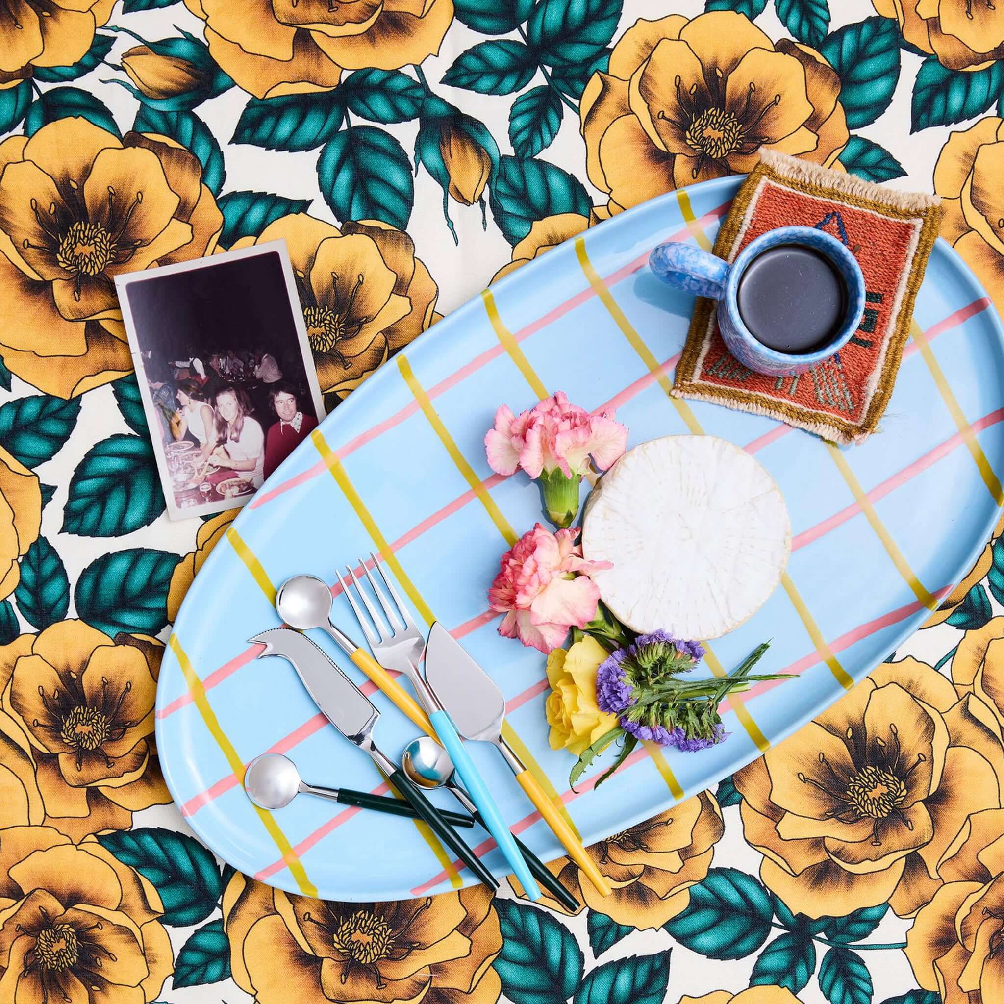 Alt Tag: Kip & Co Linen & Cotton Tablecloth - Golden Peony golden peony floral print tablecloth with blue leaves, styled dining table