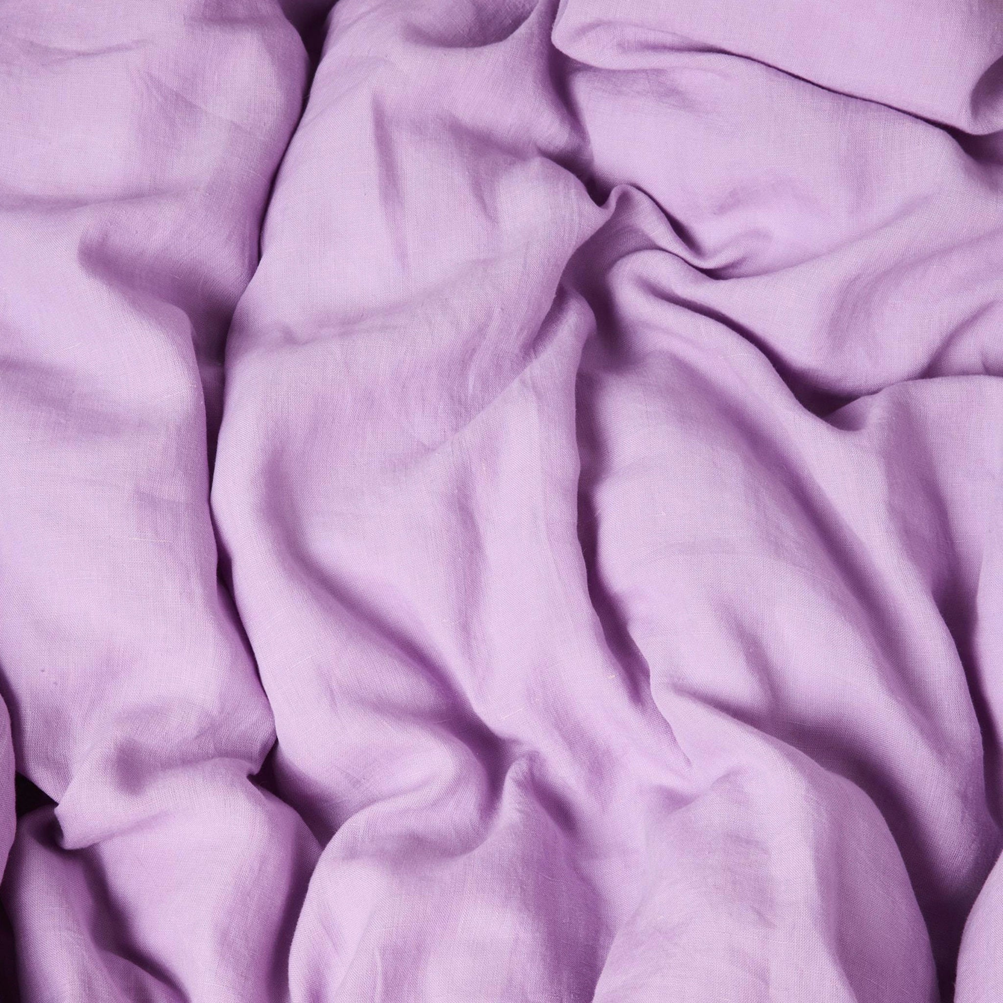 Close-up of purple fitted sheet with folds