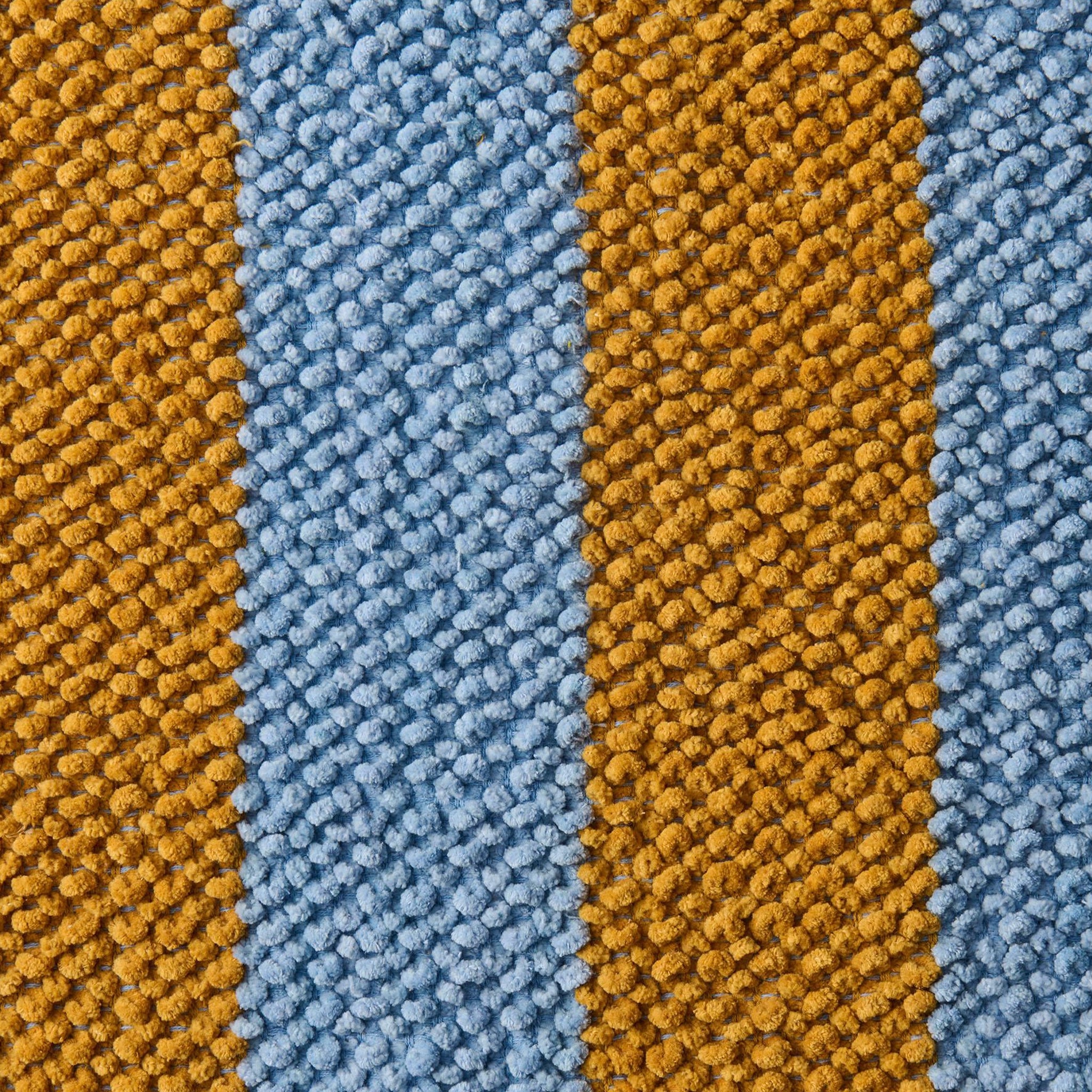 Close-up of striped fabric with brown and blue pattern