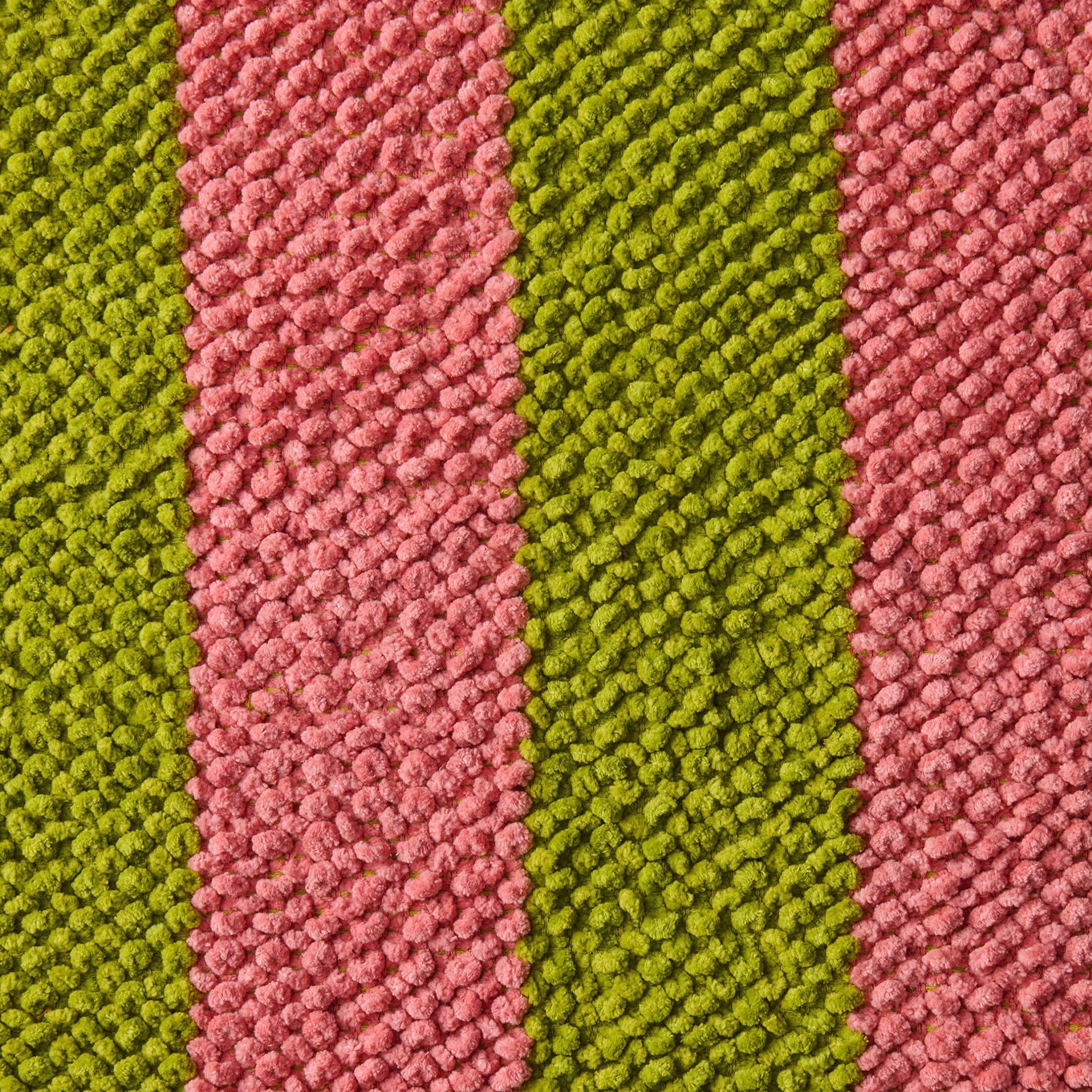 Close-up of striped fabric with pink and green colors.