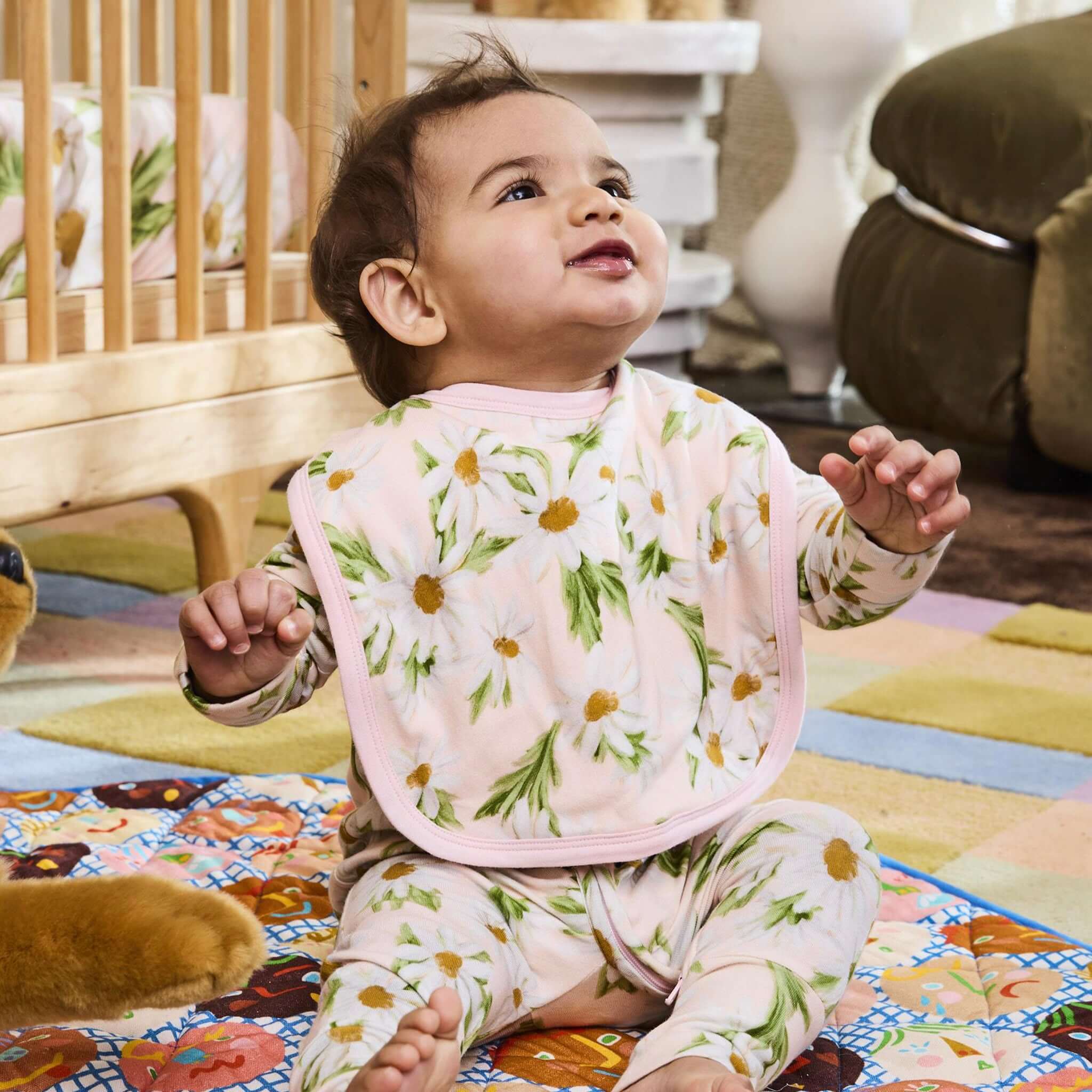 Alt Tag: Kip & Co Organic Cotton Bib - Sweet Daisy on baby, soft organic cotton bib with daisy print, gentle and planet-friendly