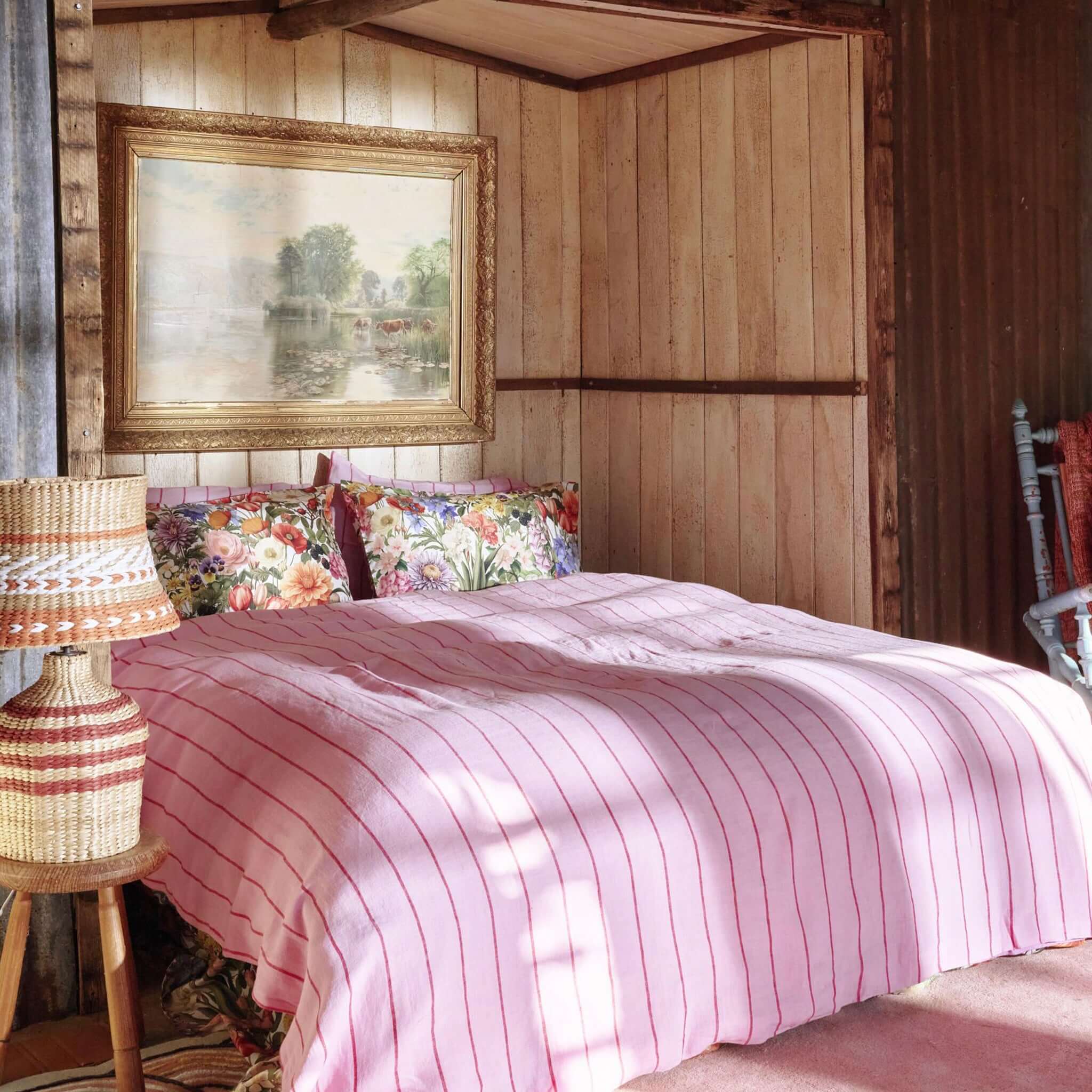 Alt Tag: Kip & Co Silk Pillowslip - Cottage Garden floral silk pillowcase on bed in rustic cottage bedroom, 22 momme mulberry silk