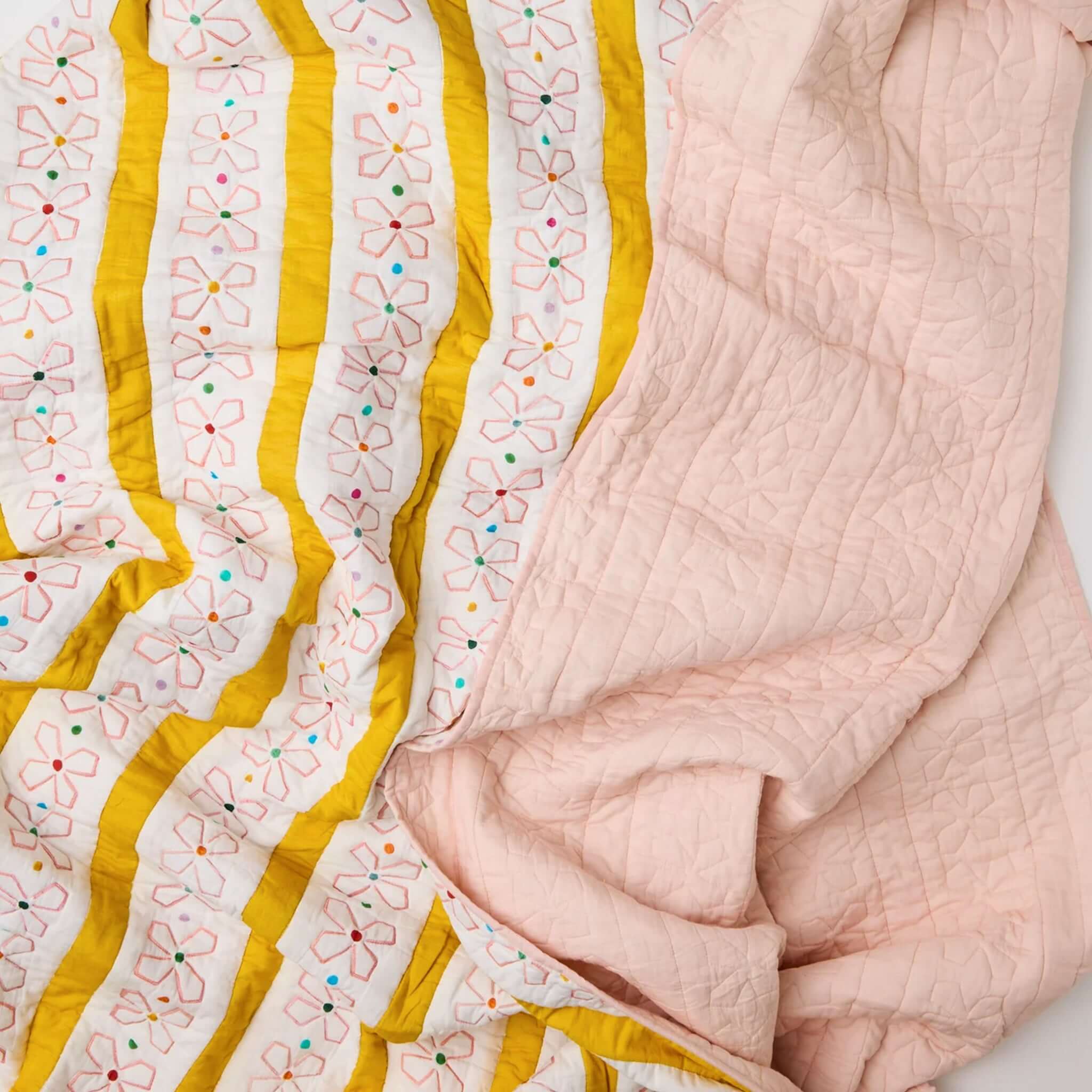 Kip & Co x Anna Spiro Daisy Chain Organic Cotton Quilted Bedspread - Large featuring floral patterns and pastel colors.