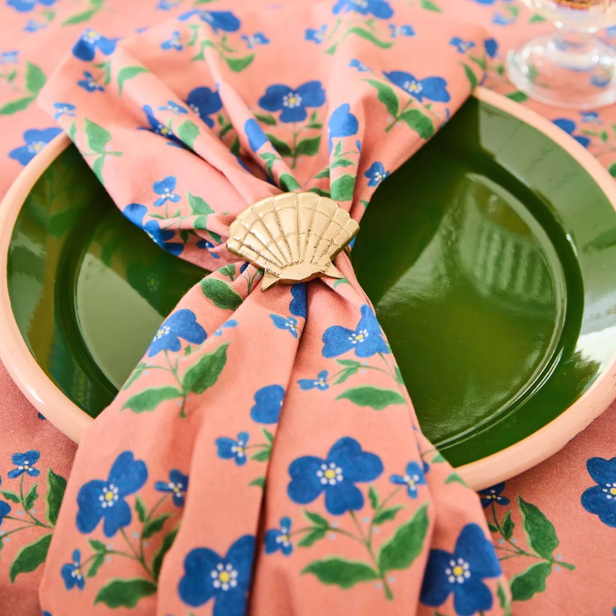 Kip & Co x Anna Spiro Linen & Cotton Napkin Set - Indian Summer Rose beautifully styled on a green plate.