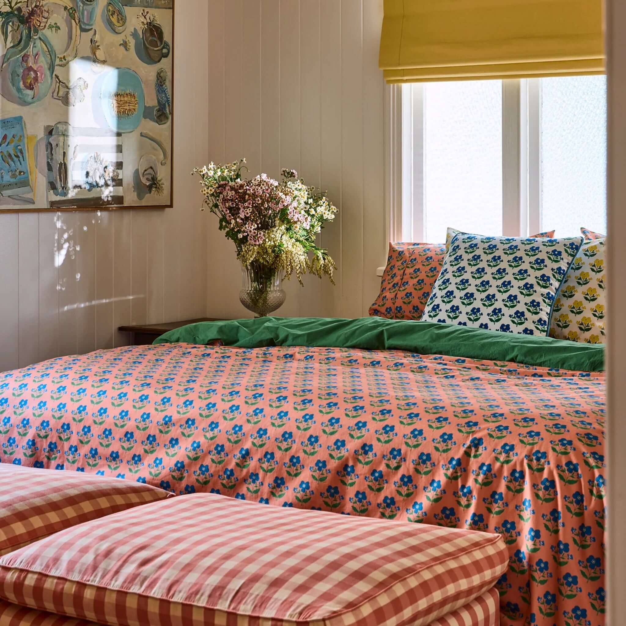Kip & Co x Anna Spiro Organic Cotton Duvet Cover - Indian Summer Pink set on a vibrant bedroom with floral decor.