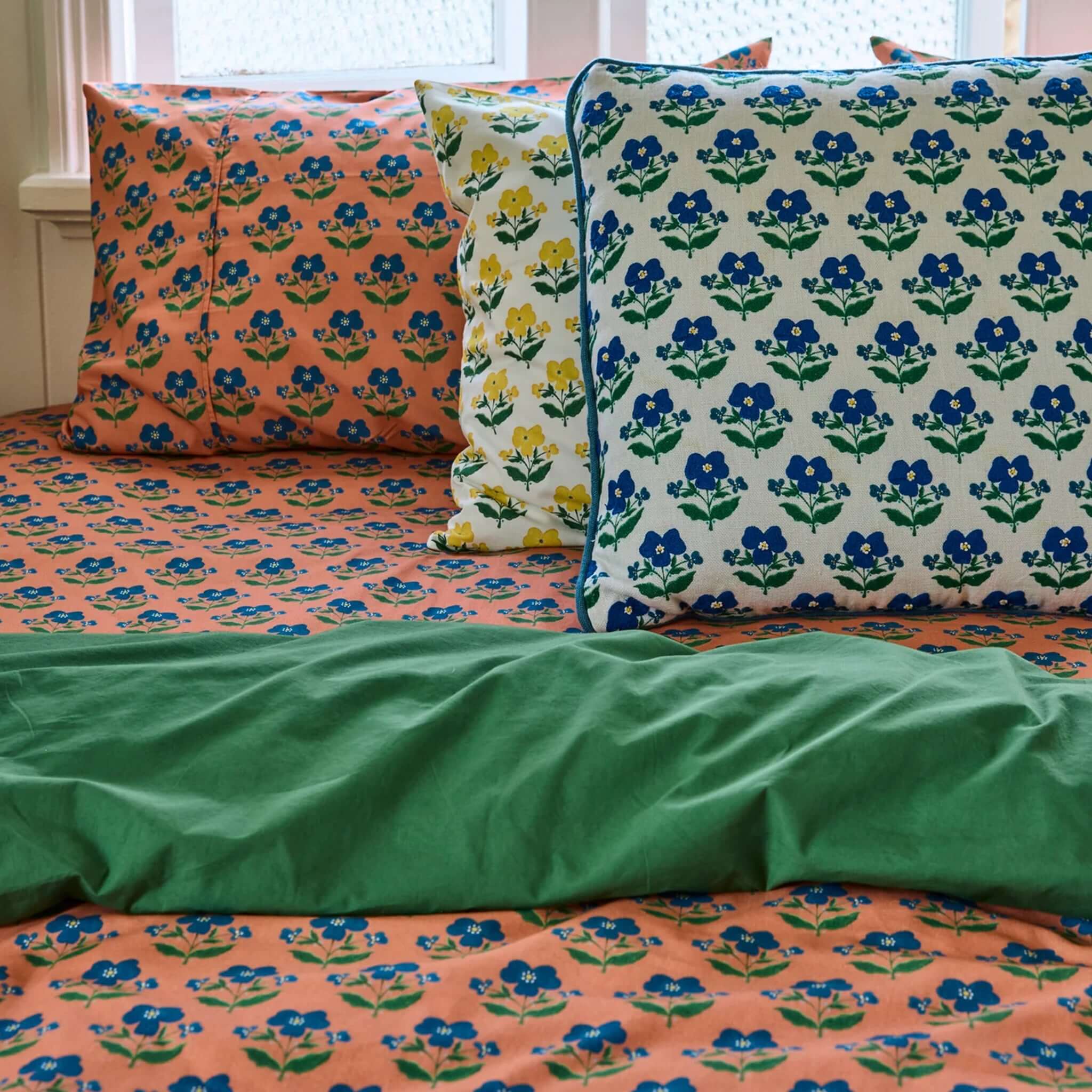 Kip & Co x Anna Spiro Organic Cotton Pillowslip Set - Indian Summer Rose on floral patterned bedding