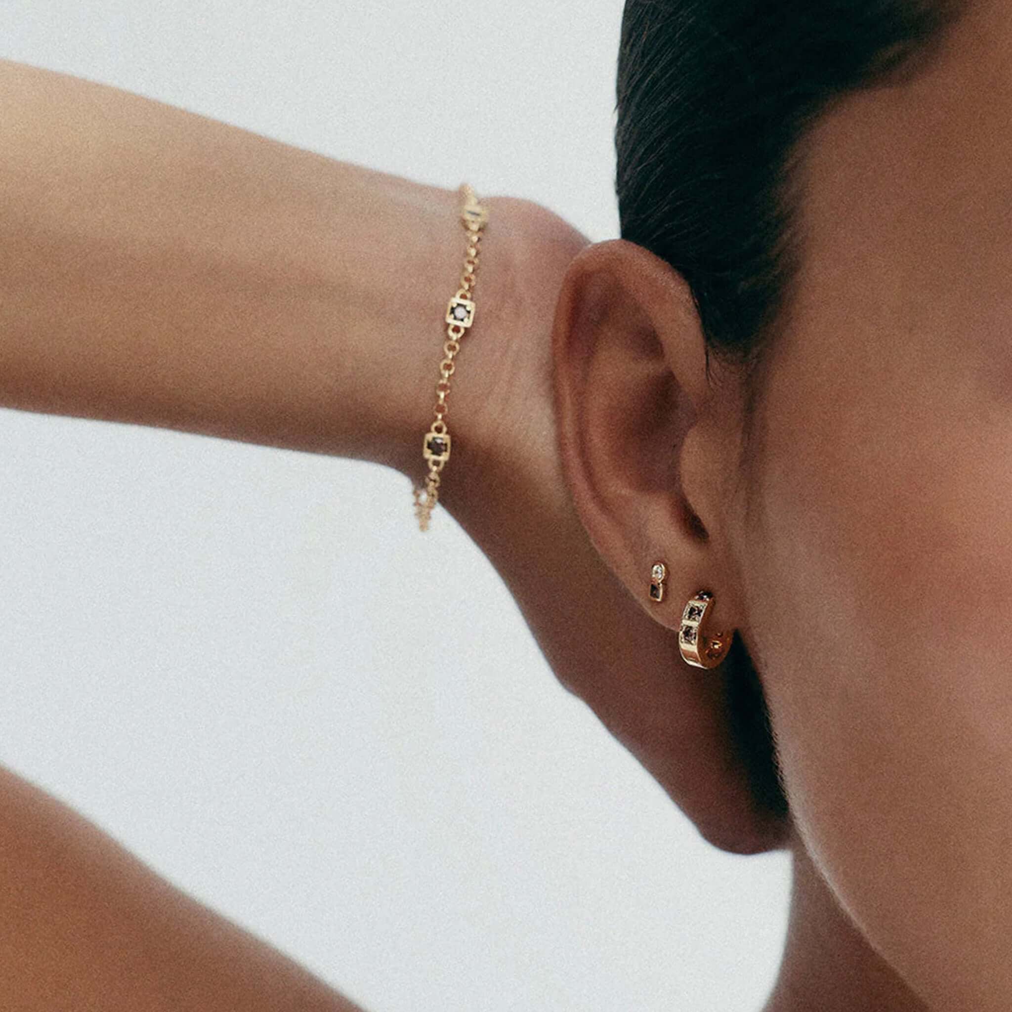 Kirstin Ash Ember Collection Renewal Bracelet - Gold Plated worn on a model's wrist, showcasing gold plating and cubic zirconia stones.