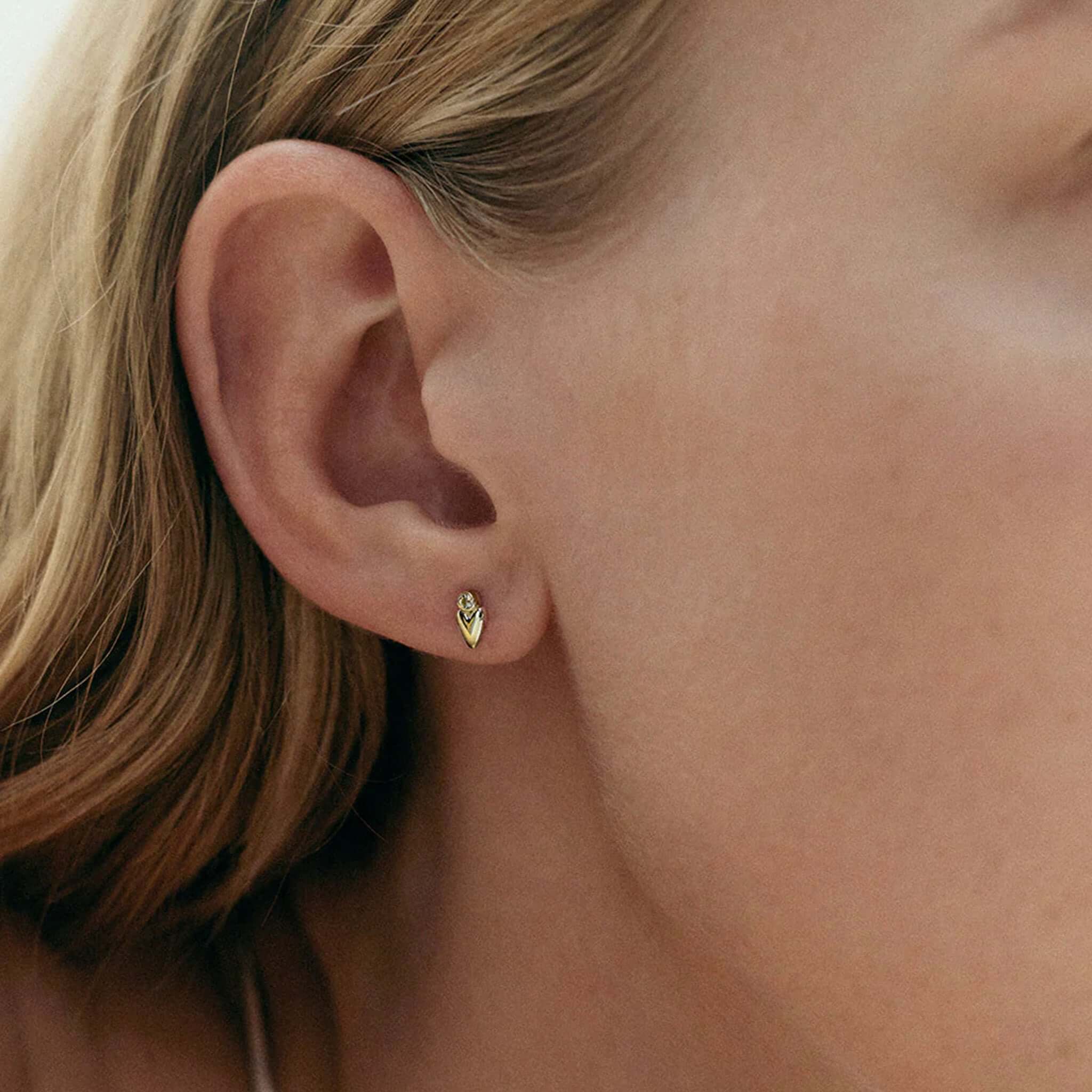 Alt Tag: Kirstin Ash Vista Collection Abode Heart Stud Earrings on ear, petite heart stud with white topaz gemstone