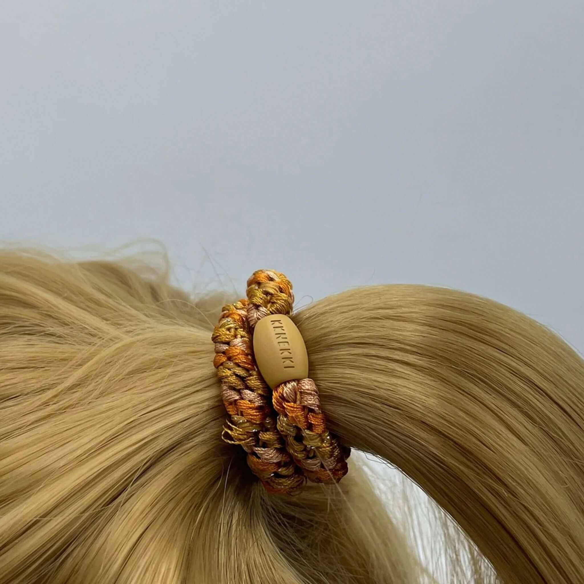 Alt Tag: Kknekki Hair Tie - Nude Curry Glitter Mix woven hair tie on blonde ponytail, strong no-damage hold, waterproof fade-resistant