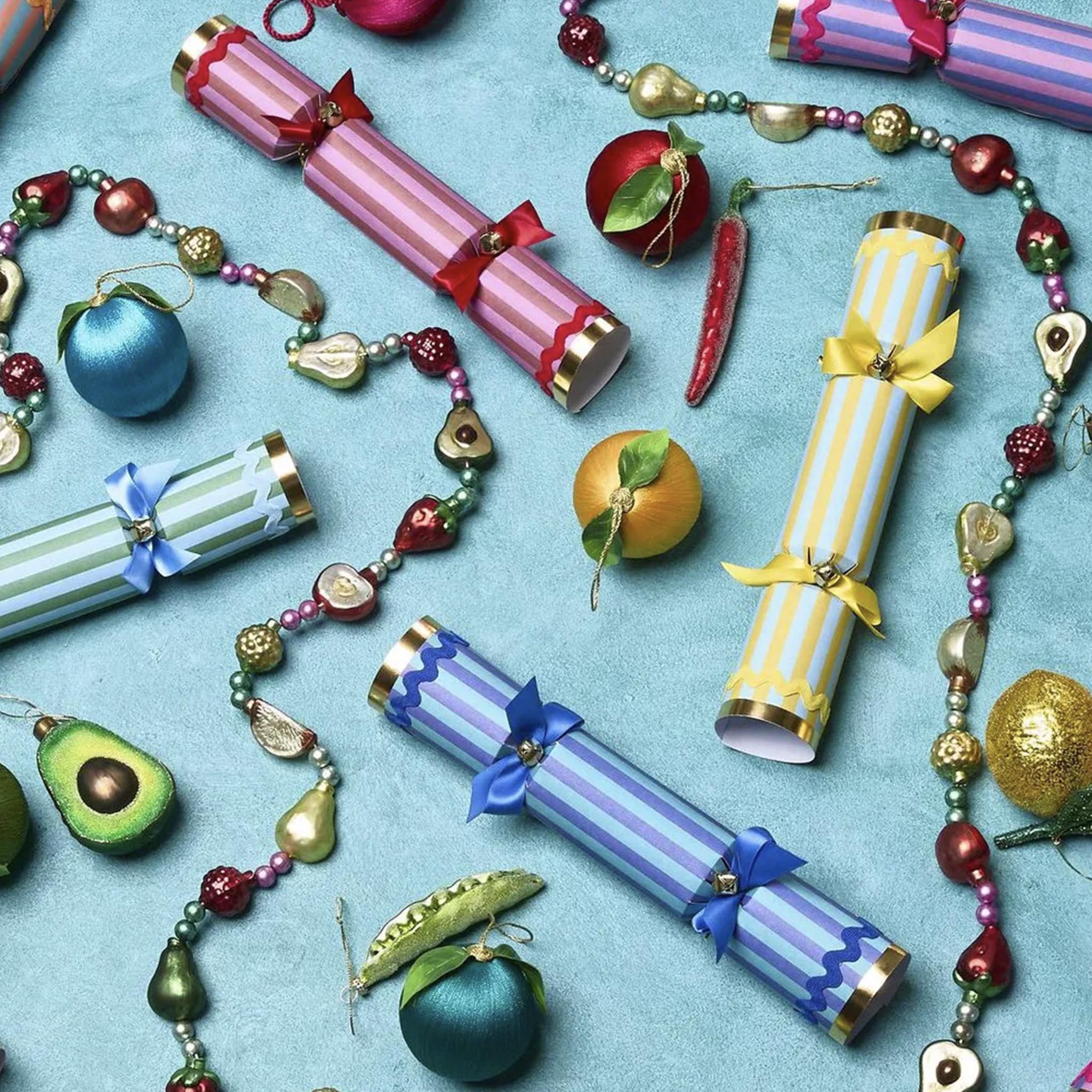 Decorative Christmas crackers and ornaments on a blue background