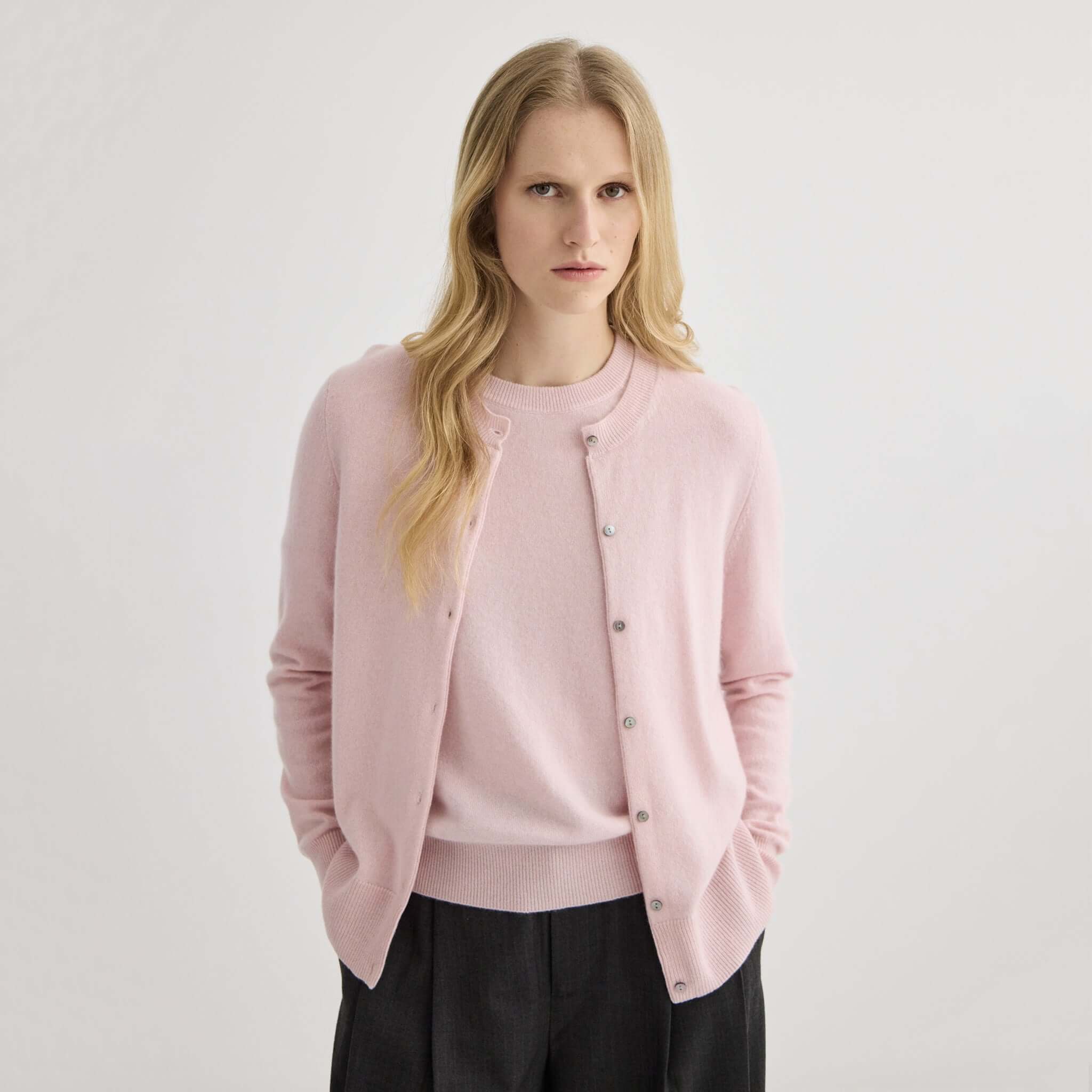 Alt Tag: Laing Cashmere Crewneck Cardigan - Blush in A-Grade Mongolian cashmere, crewneck with shell buttons, worn on model