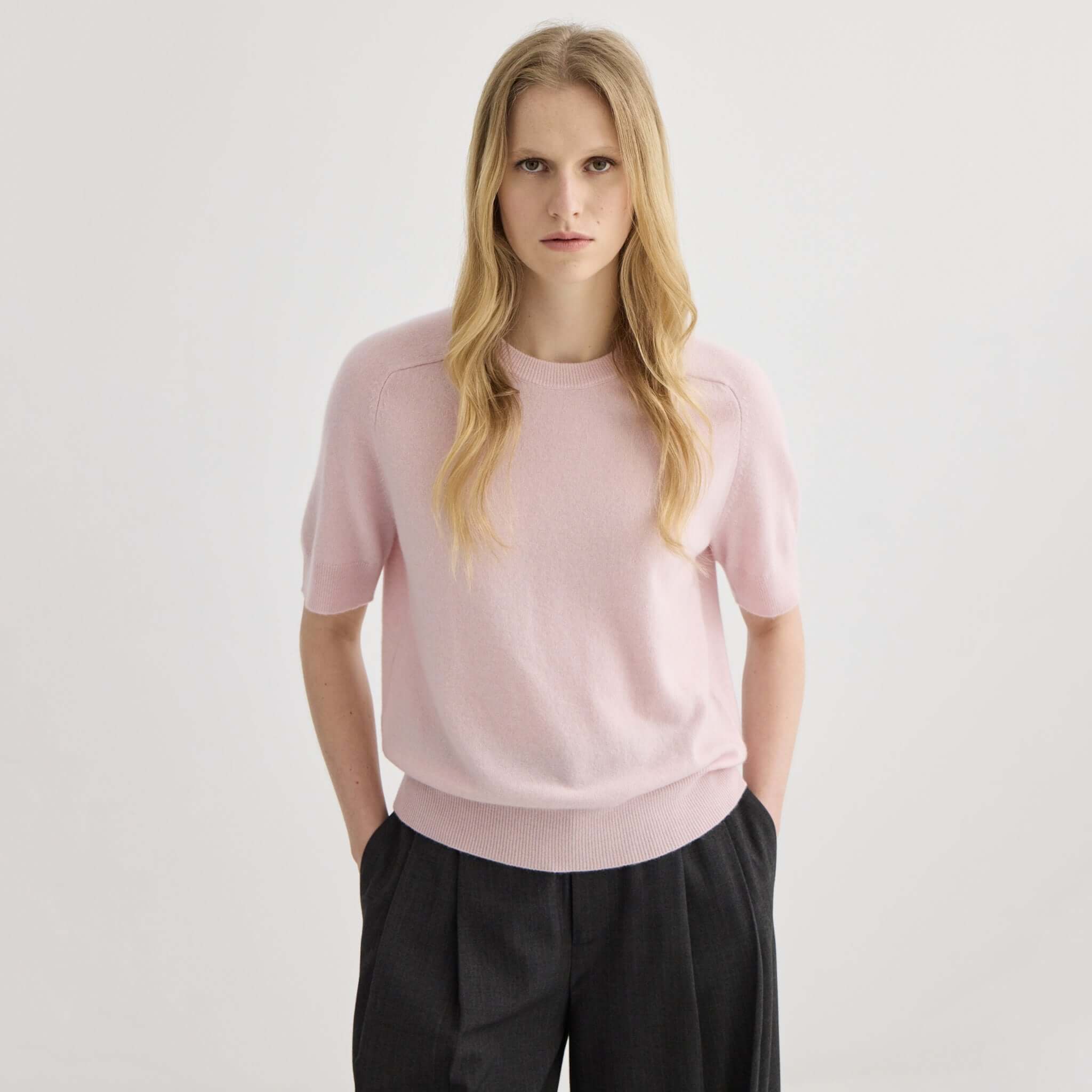 Alt Tag: Laing Jasper Cashmere Short Sleeve Crewneck - Blush pink cashmere short sleeve crewneck sweater on model, lightweight knit