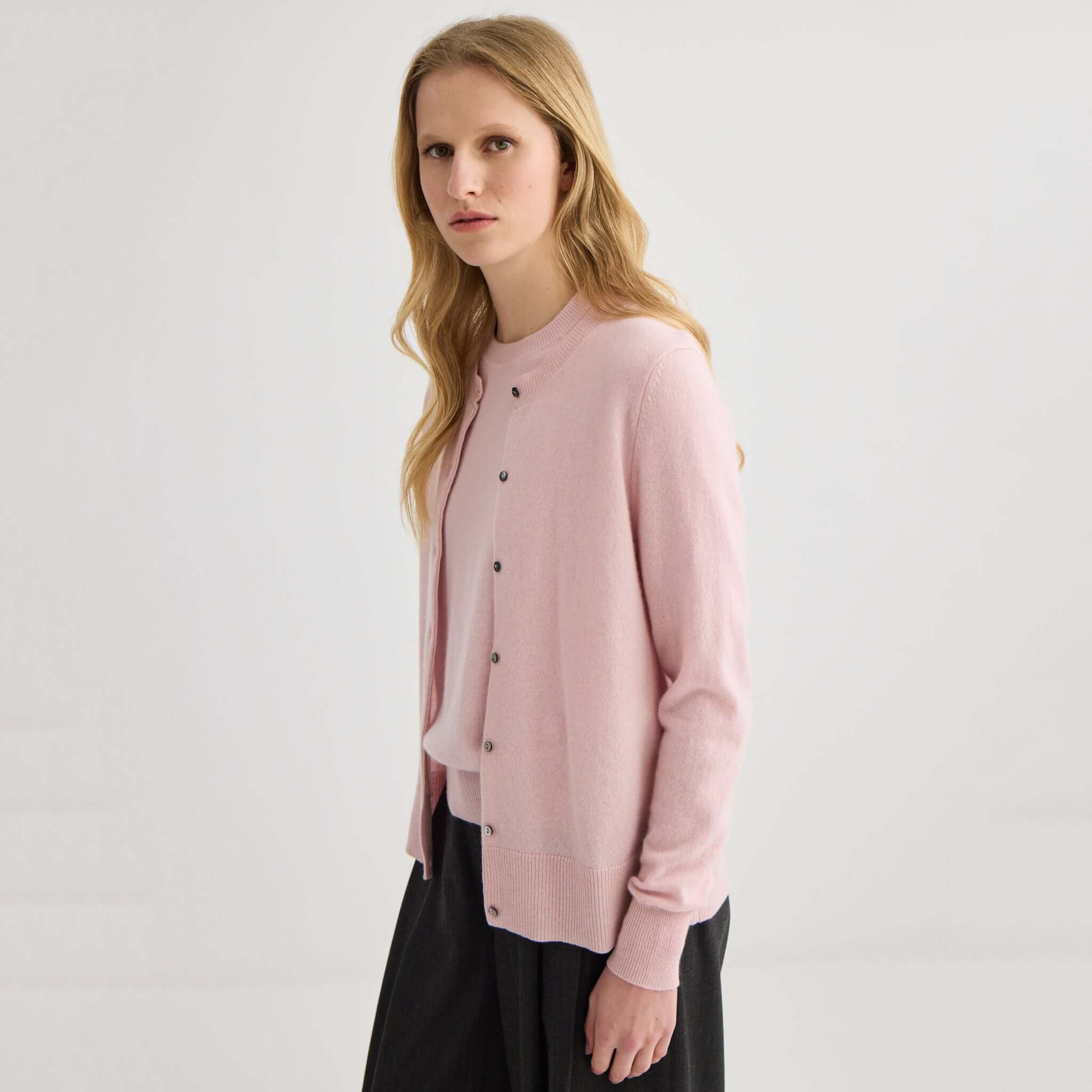 Alt Tag: Laing Cashmere Crewneck Cardigan - Blush on model, fine knit A-Grade Mongolian cashmere crewneck with shell buttons