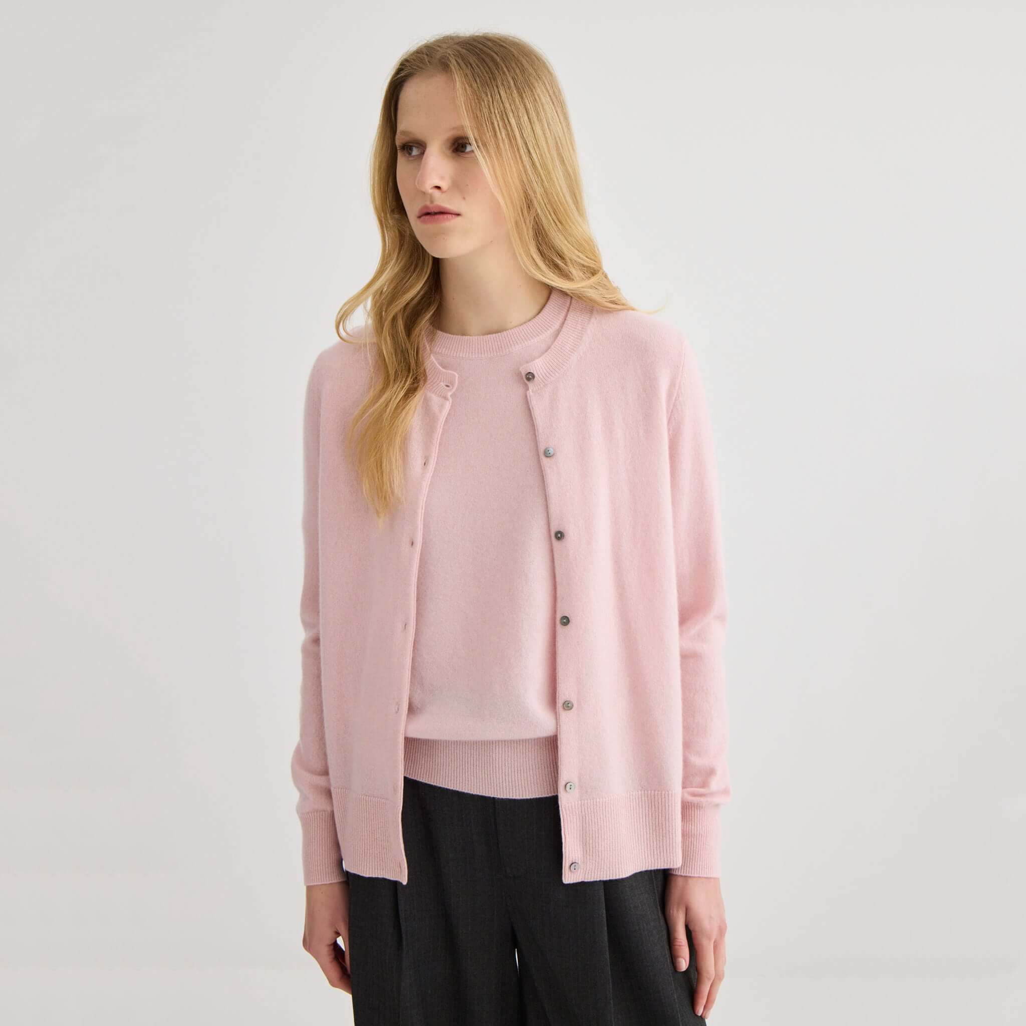 Alt Tag: Laing Cashmere Crewneck Cardigan - Blush on model, A-Grade Mongolian cashmere 12-gauge knit with shell buttons