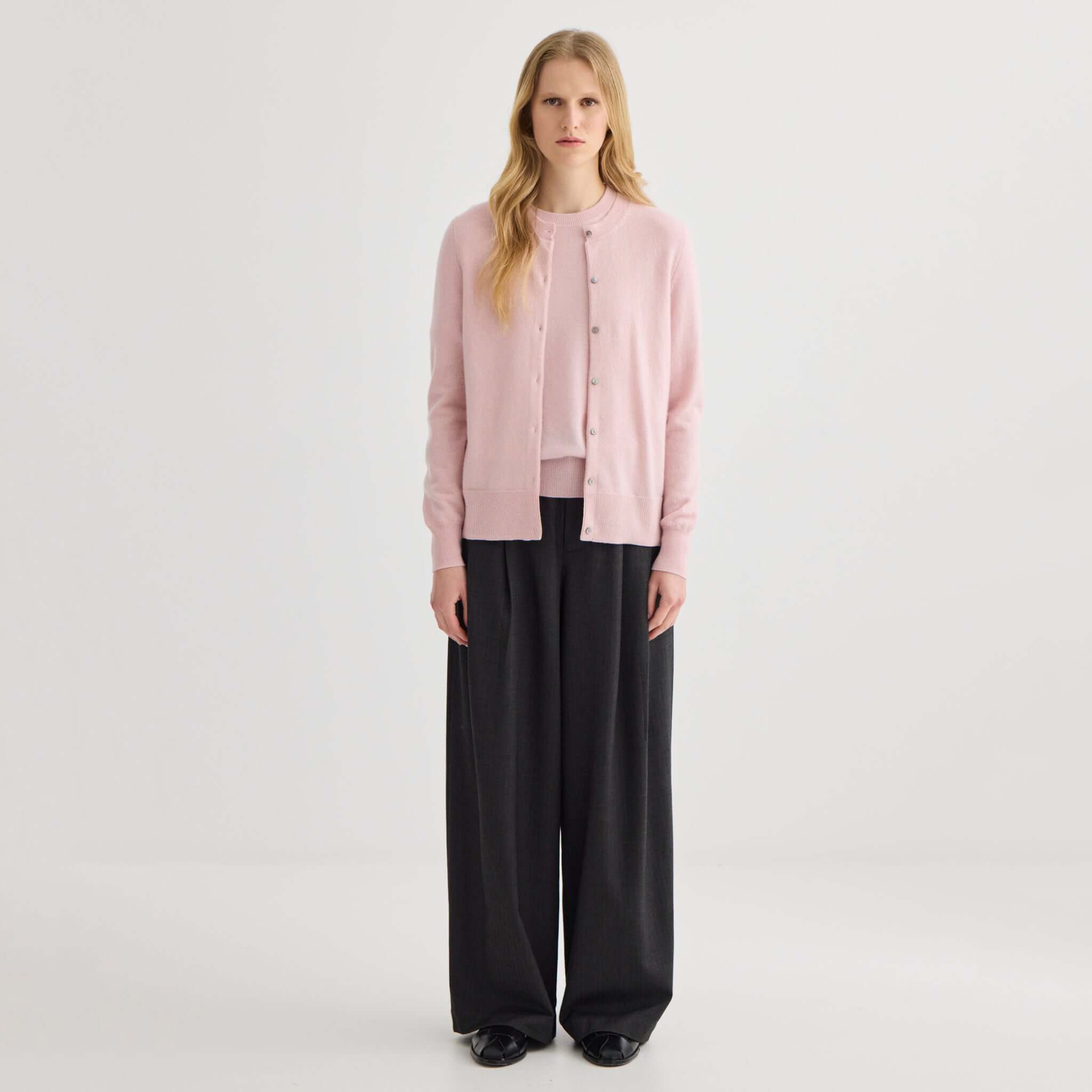 Alt Tag: Laing Cashmere Crewneck Cardigan - Blush on model, A-Grade Mongolian cashmere crewneck with shell buttons, front view