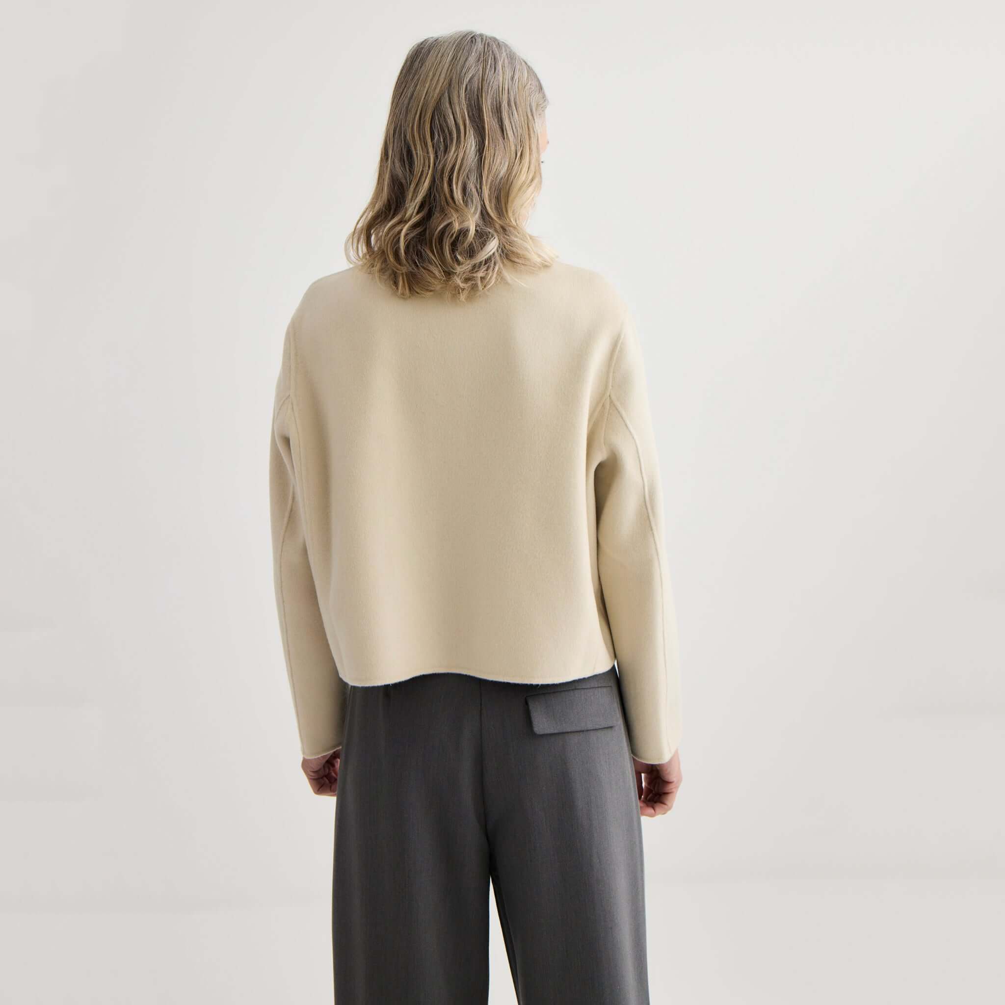 Alt Tag: Back view of Laing Cashmere & Wool Cardi Jacket - Ivory, cropped collarless cashmere-wool blend jacket with structured bonded knit