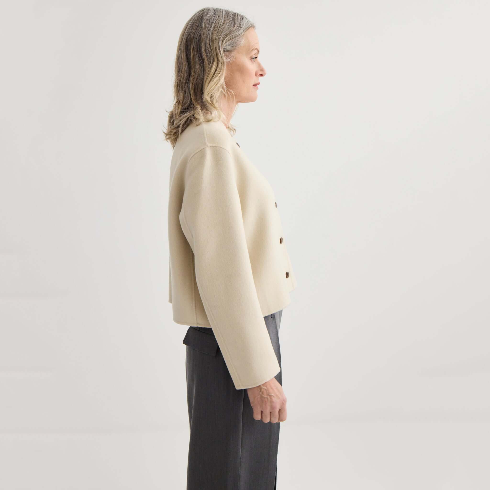 Alt Tag: Laing Cashmere & Wool Cardi Jacket - Ivory side view, cropped collarless cashmere-wool blend bonded jacket with structured warmth