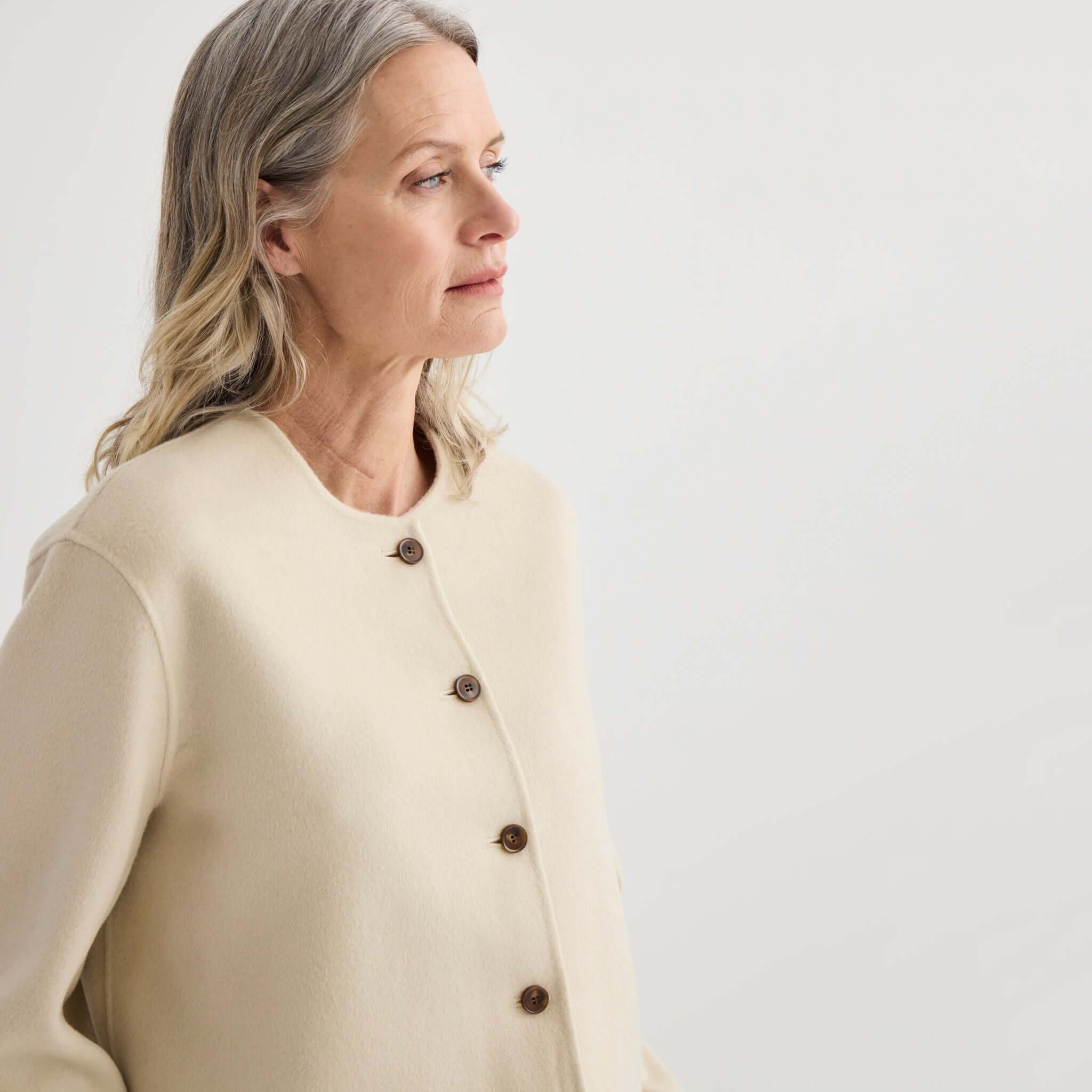 Alt Tag: Laing Cashmere & Wool Cardi Jacket - Ivory worn by model, cropped collarless cashmere-wool blend cardi jacket with buttons