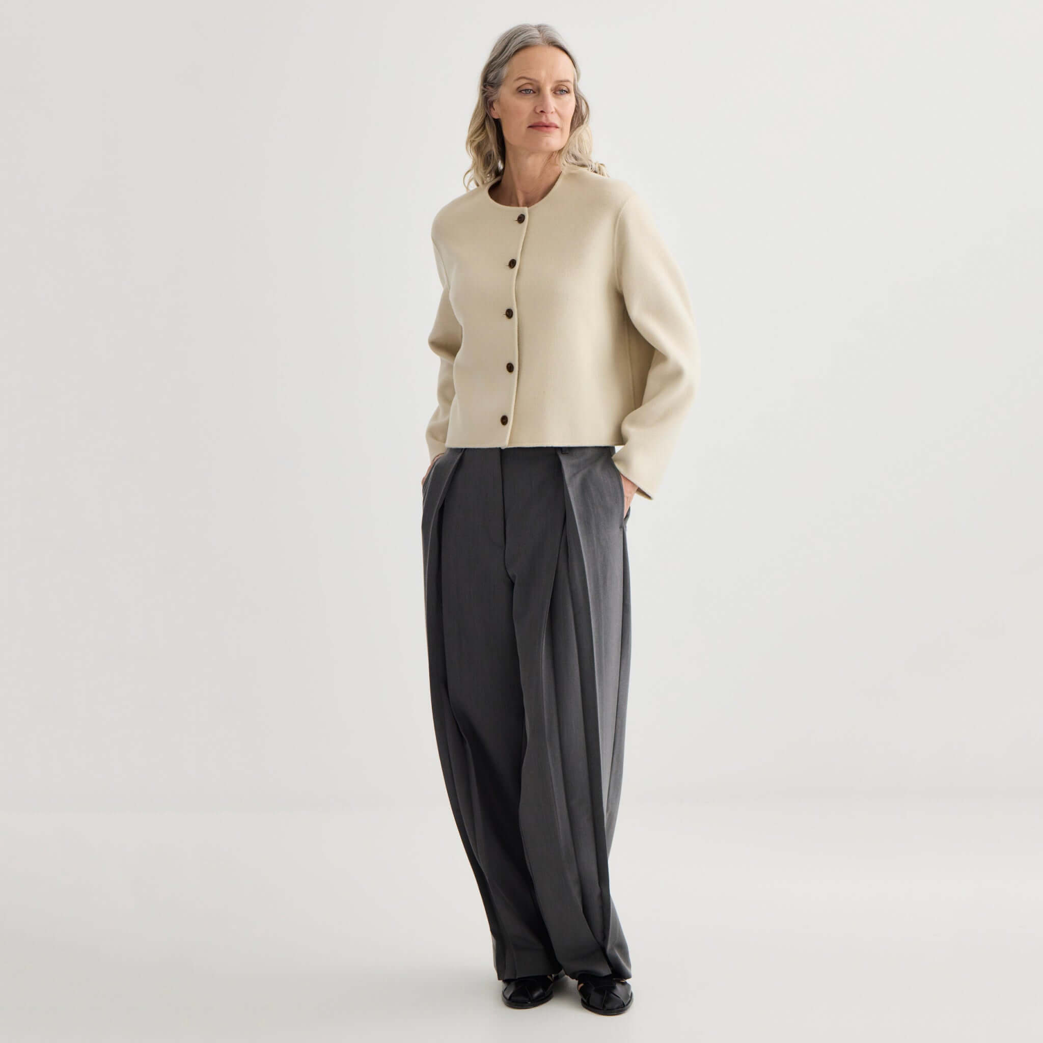 Alt Tag: Laing Cashmere & Wool Cardi Jacket - Ivory cropped collarless cardi jacket on model, bonded cashmere-wool blend, modern layering