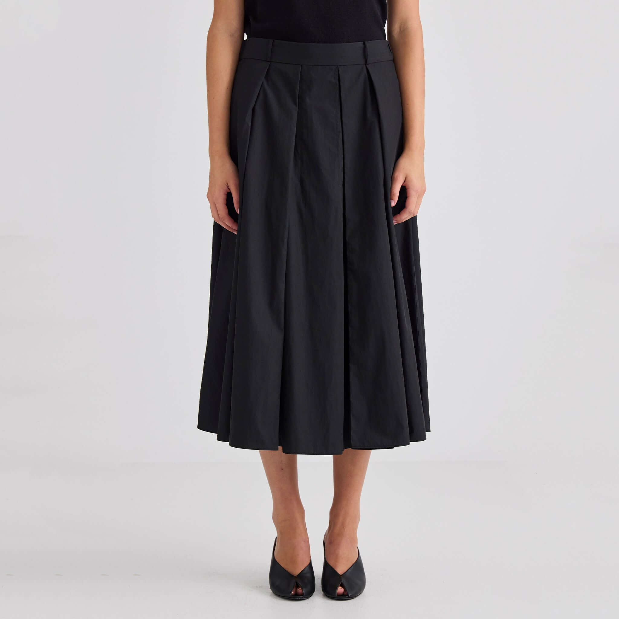 Laing Ellis Pleated Skirt - Black, midi-length pleated skirt with deep box pleats and elasticated waistband.