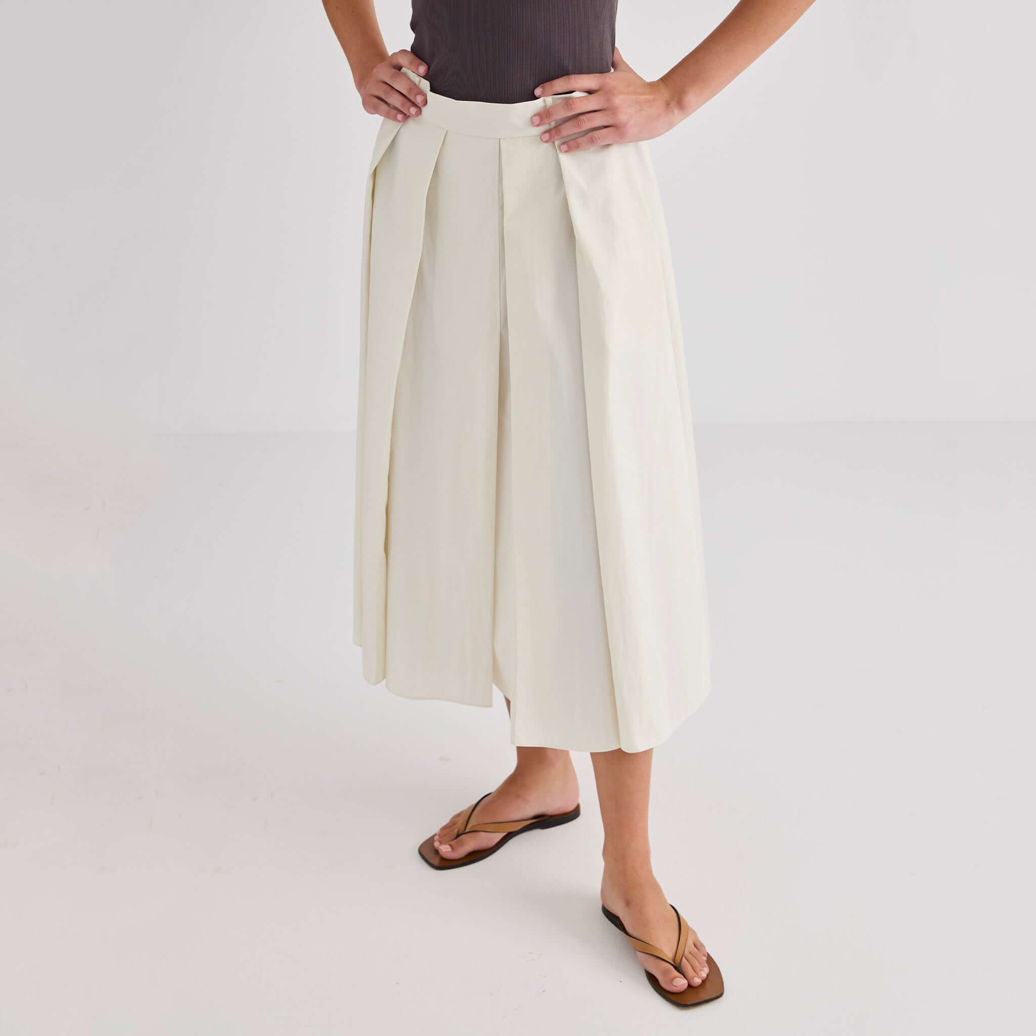 Laing Ellis Pleated Skirt - Cream showcased with deep box pleats and an elasticated waistband.