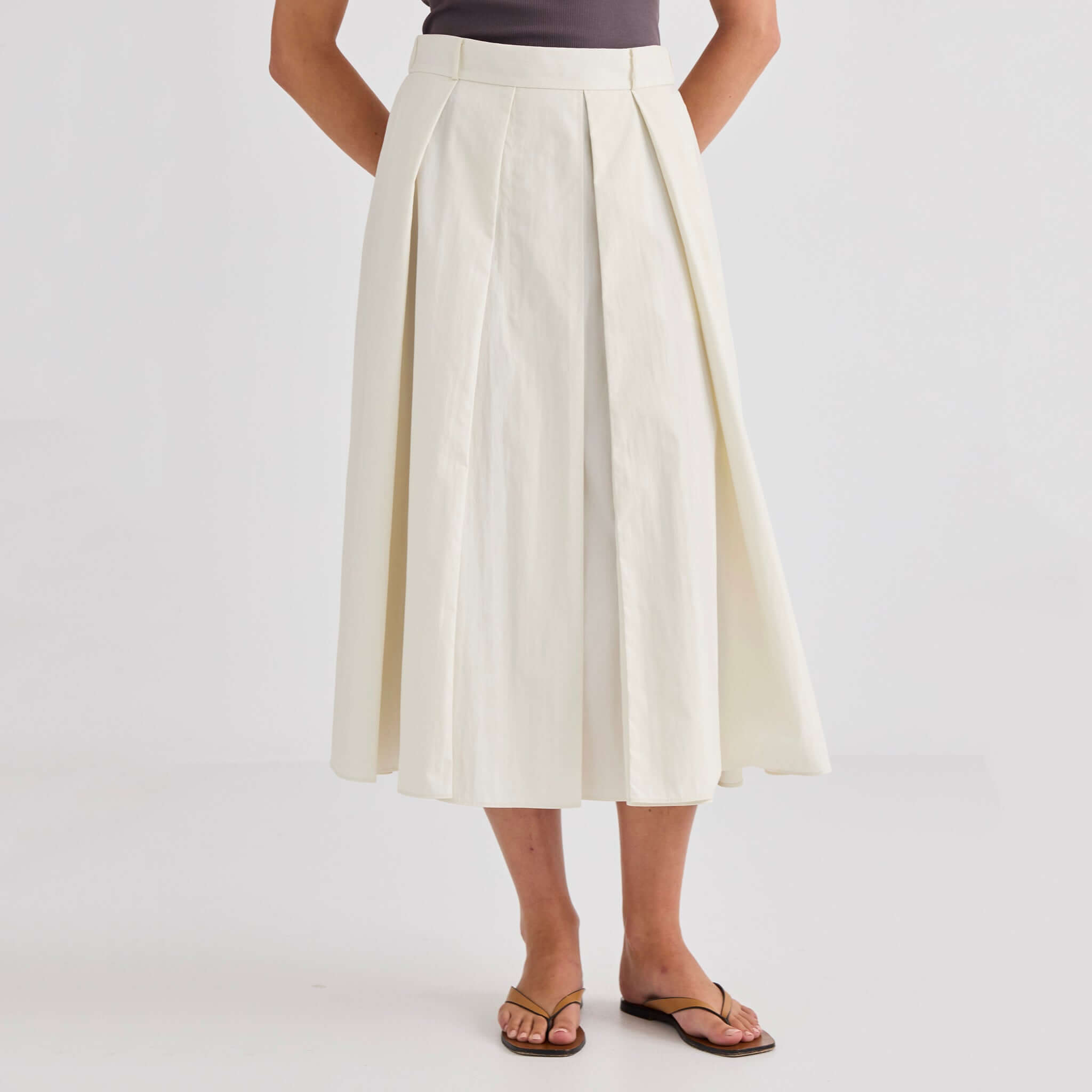 Laing Ellis Pleated Skirt - Cream, midi-length skirt with deep box pleats and elasticated waistband.