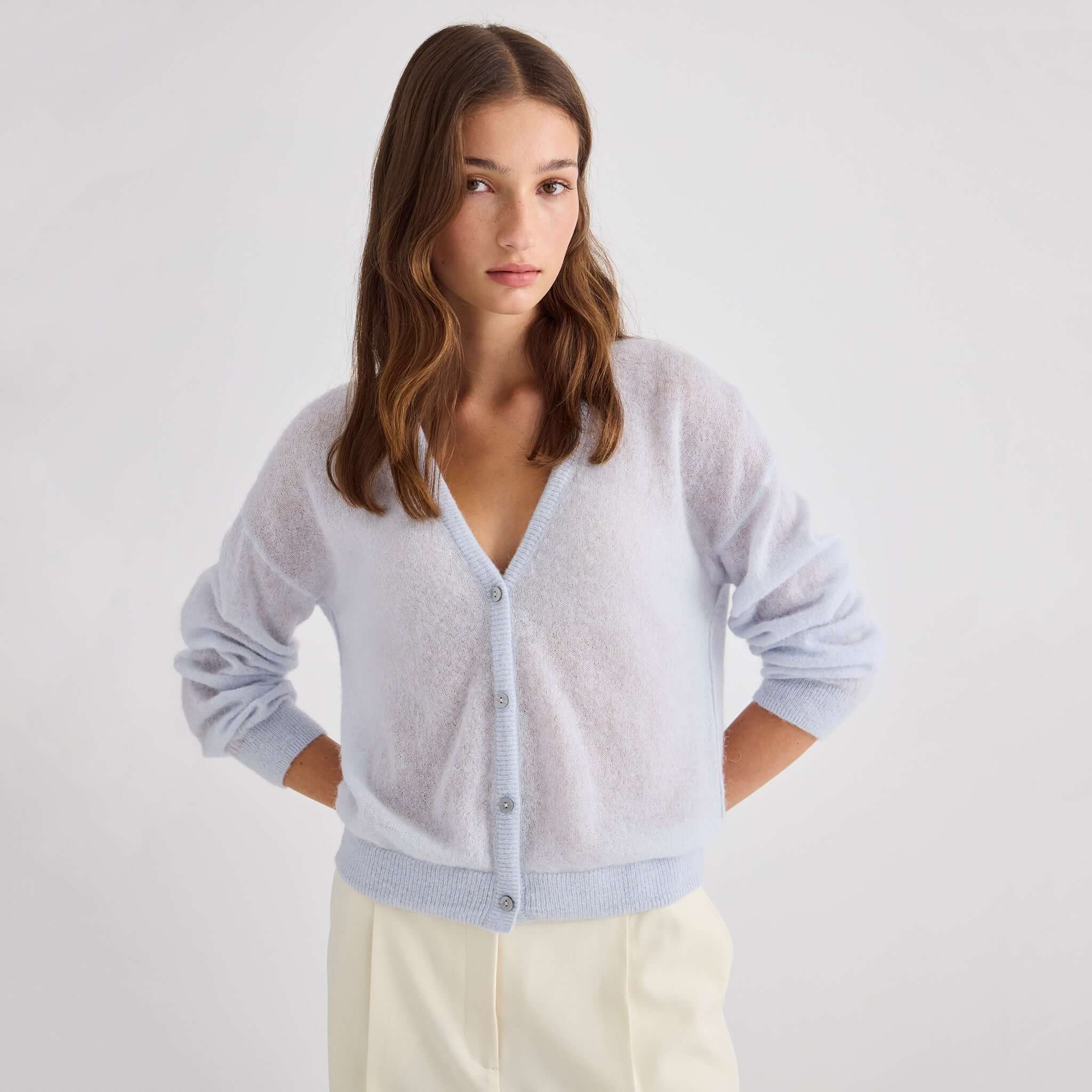 Laing Mila Alpaca & Merino Cardigan - Pale Blue worn by a model, showcasing its soft texture and relaxed fit.