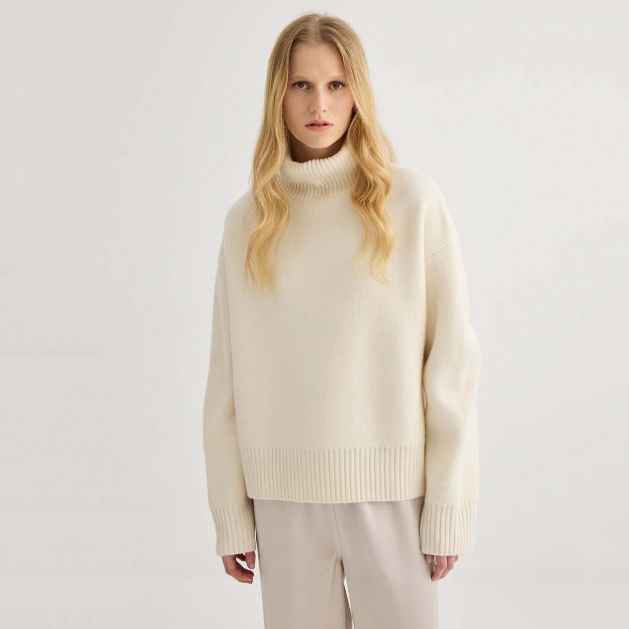 Laing Nico Merino Oversized Sweater - Cream worn by model, featuring a cozy turtleneck and slouchy fit, perfect for winter.