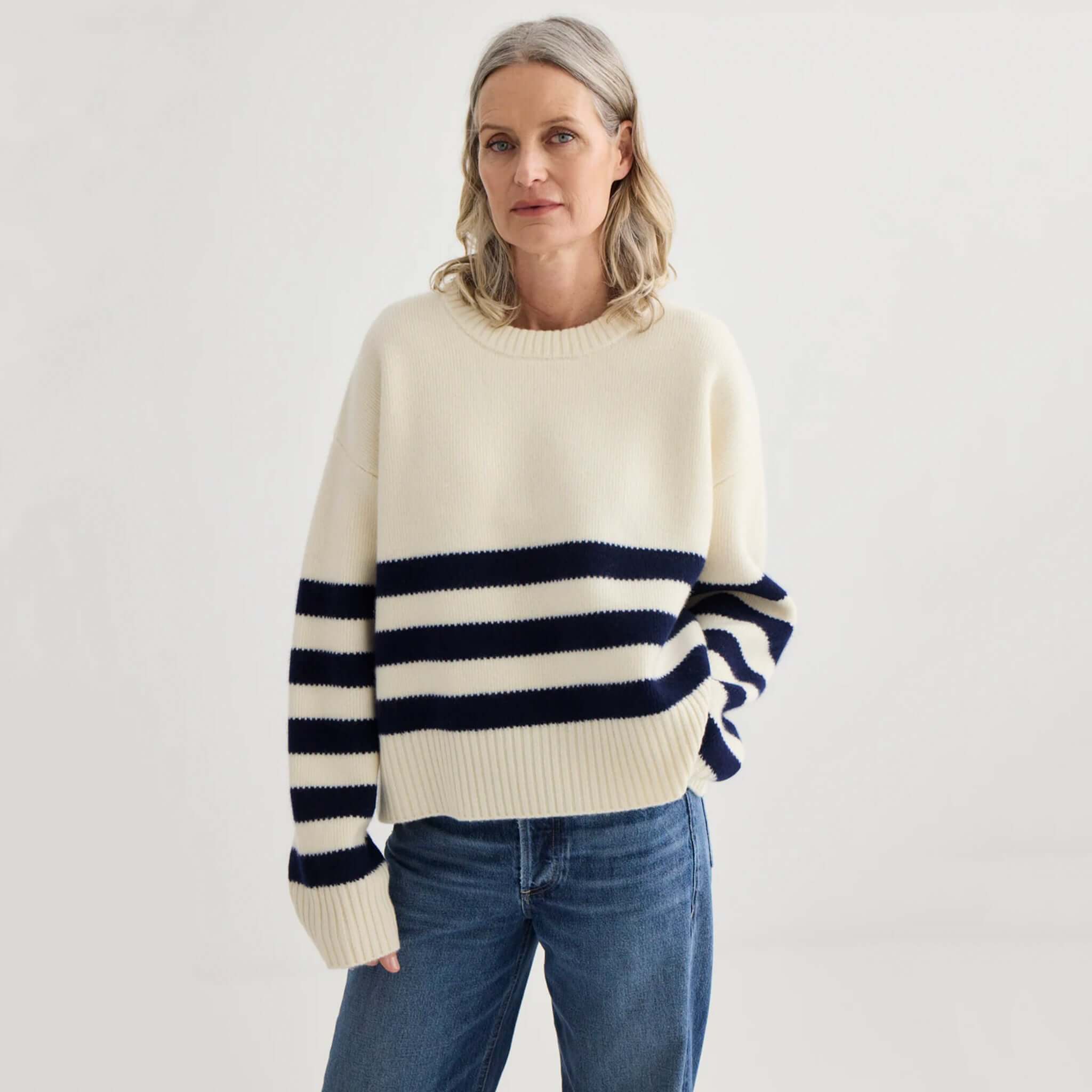 Laing Oversized Stripe Crew - Ivory & Midnight worn by a model, showcasing bold midnight stripes on an ivory knit.